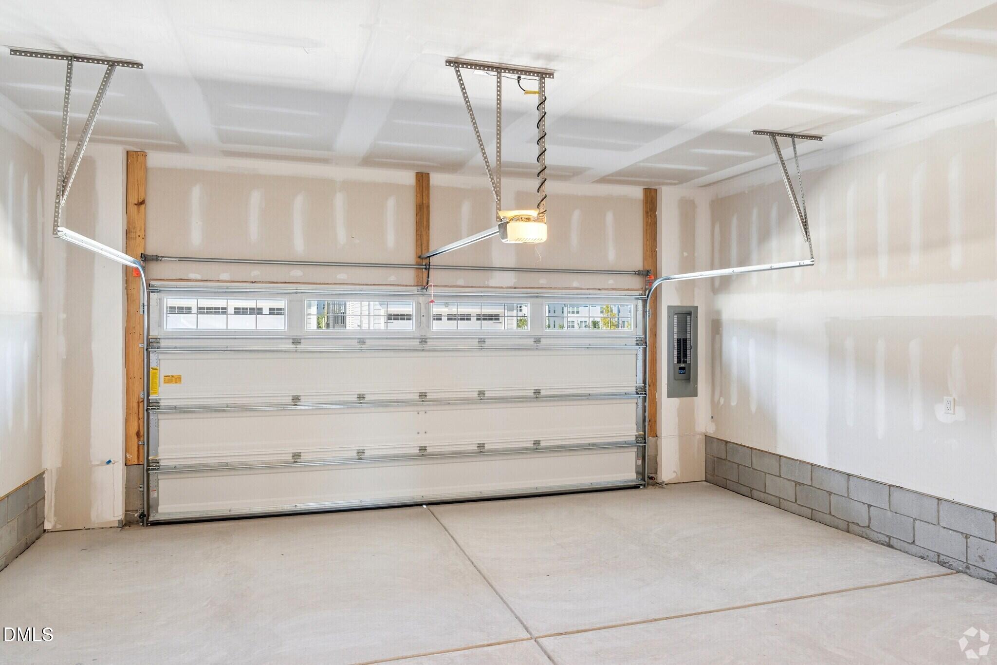 Spacious 2-car garage with automatic door opener and windows in Davidson Homes The Mitchell townhome, Knightdale, NC