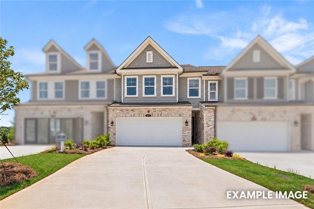 Front exterior of 2-story Davidson Homes The Wake G plan with 2-car garage in Hemingway, Cumming, Georgia