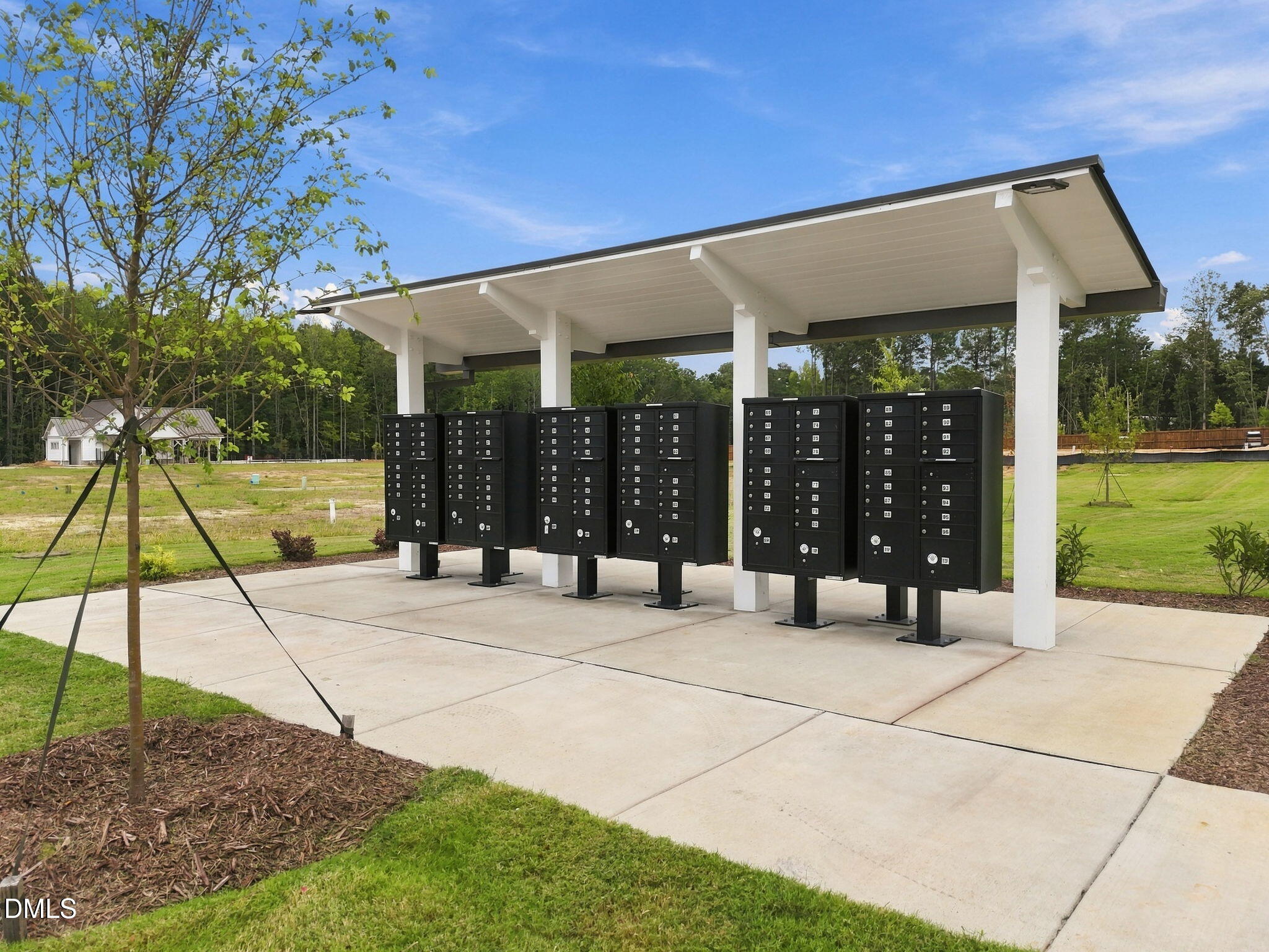 Covered community mailbox kiosk with black cluster mailboxes in Forestville Yard neighborhood, Knightdale, North Carolina