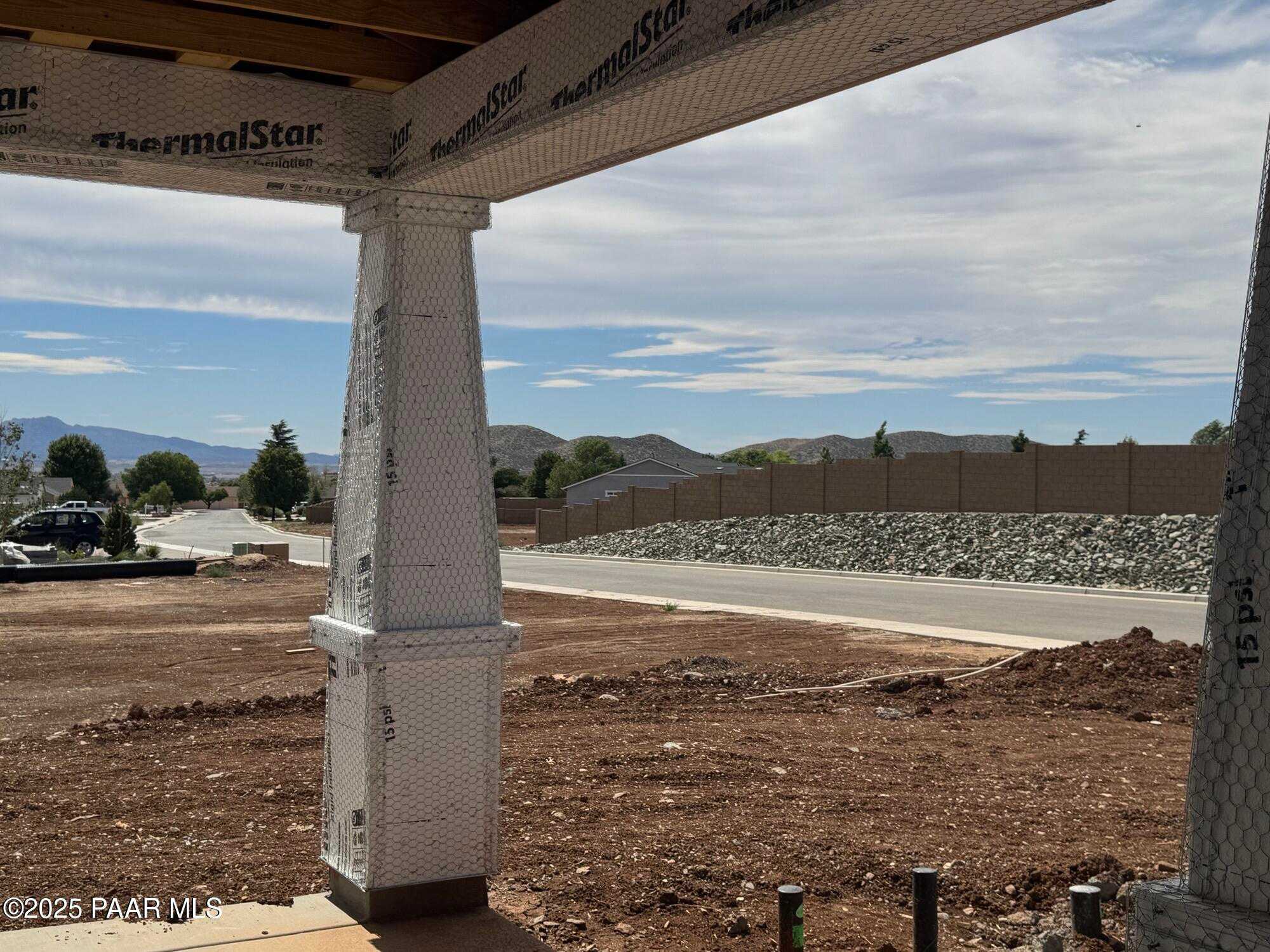Under-construction 3-bed Evermore Homes Sunrise A with insulated framing, 4-car garage, and mountain vista in Morningstar, Prescott Valley, AZ