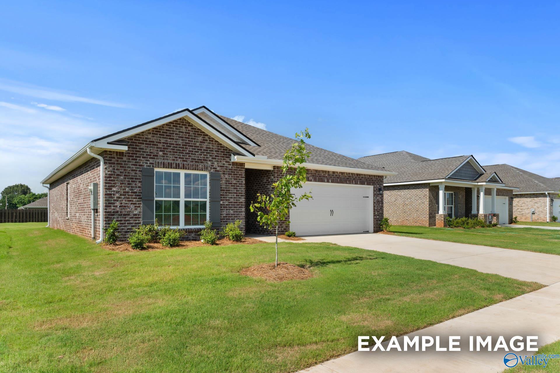 Modern brick single-story home with 2-car garage and front yard in Blue Spring, Huntsville, Alabama - Davidson Homes The Asheville