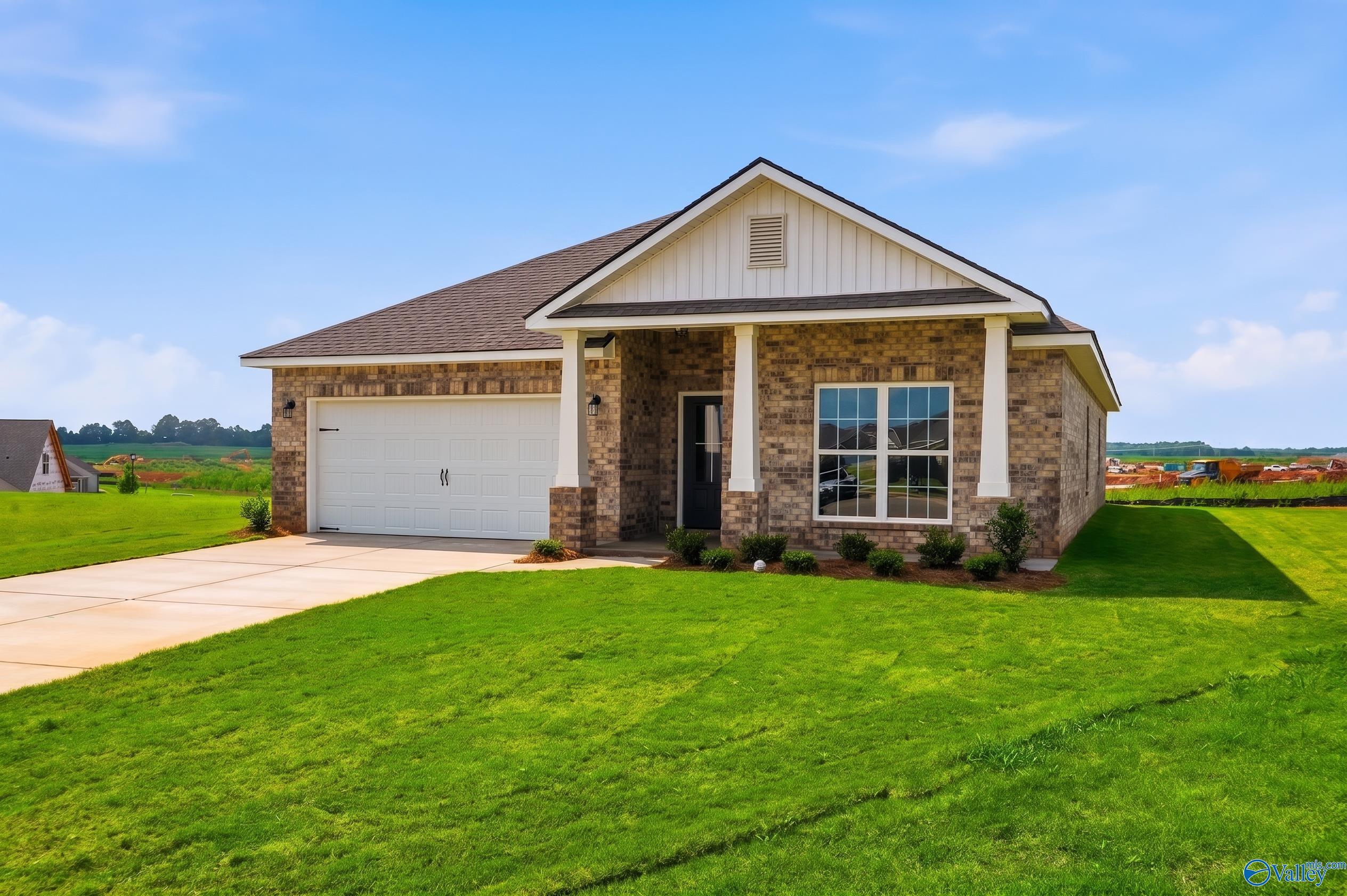 The Daphne D floor plan by Davidson Homes: 1-story brick exterior with 2-car garage in Creekside, Harvest, Alabama.