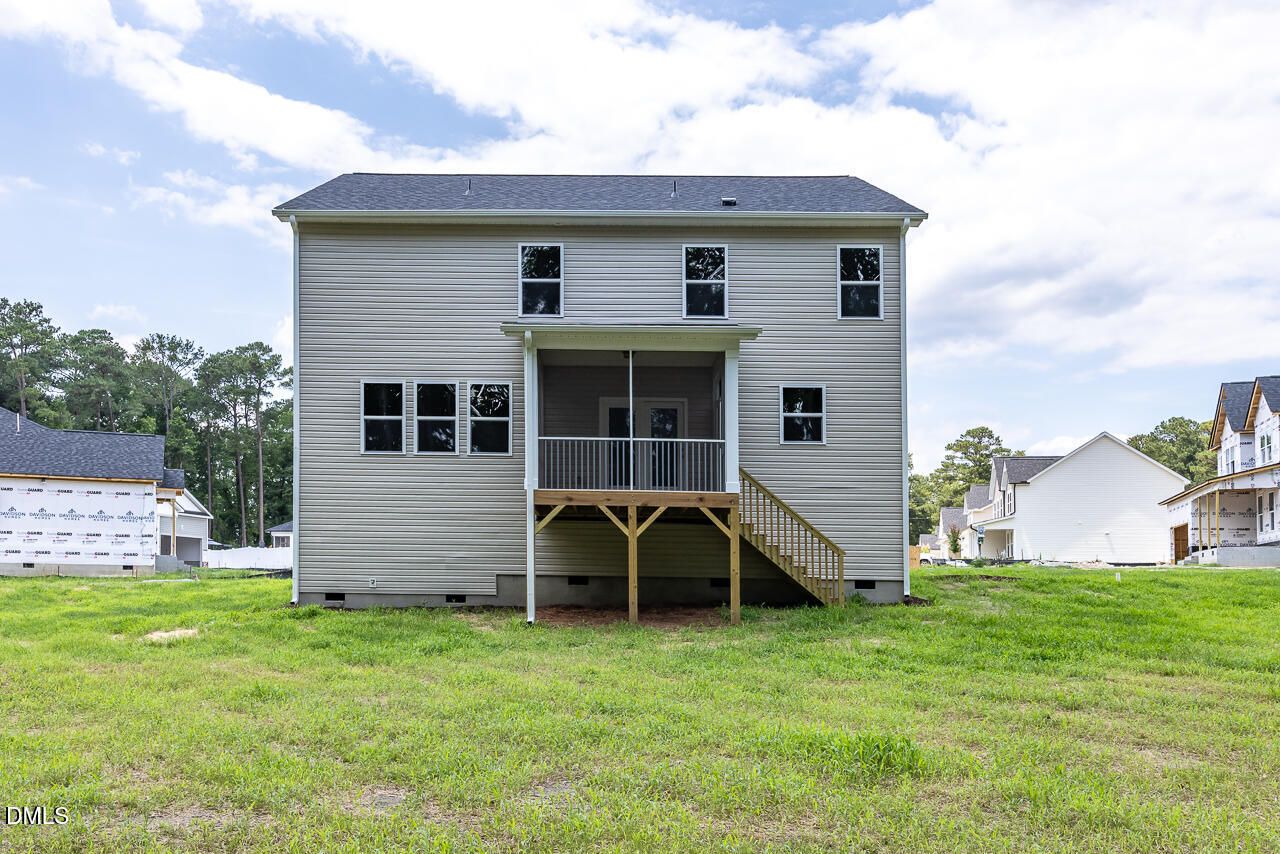 Rear view of The Hickory II B two-story home with a screened porch in Wellers Knoll, Lillington, North Carolina.