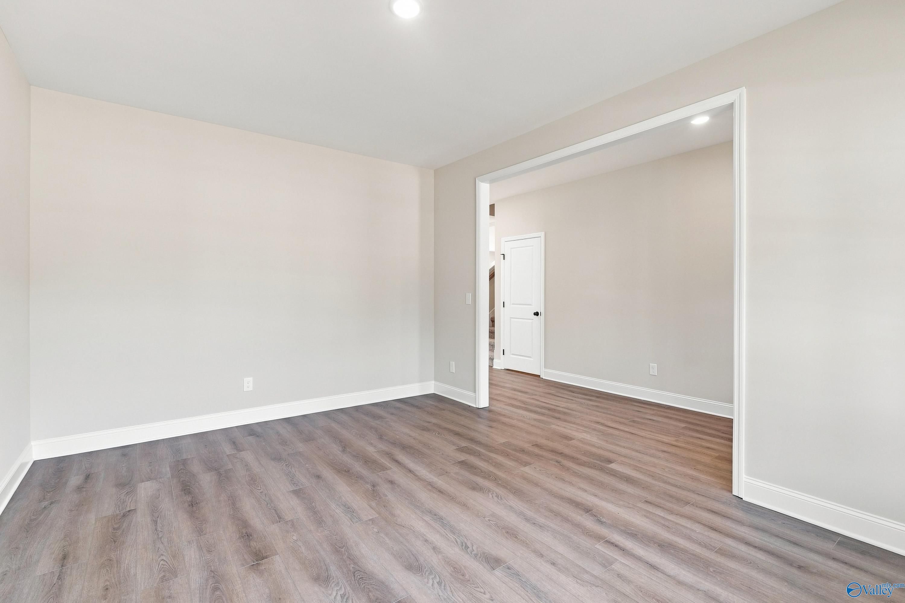 Bright open living room with luxury vinyl plank flooring in Davidson Homes The Chelsea B, Creek Grove, New Market, Alabama