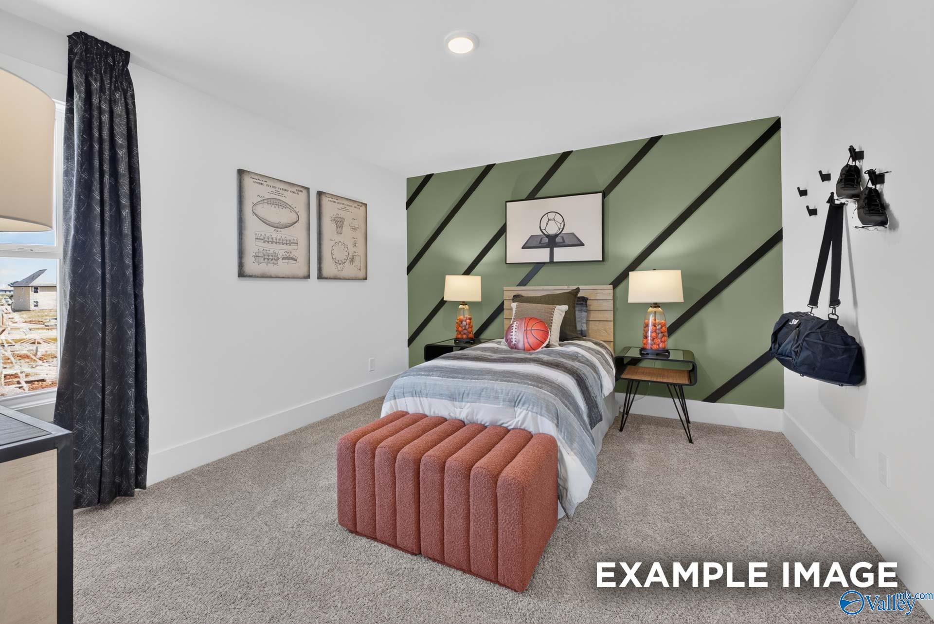 Sports-themed bedroom with green accent wall, twin bed, and basketball decor in Davidson Homes The Ashport K, Hazel Green, Alabama