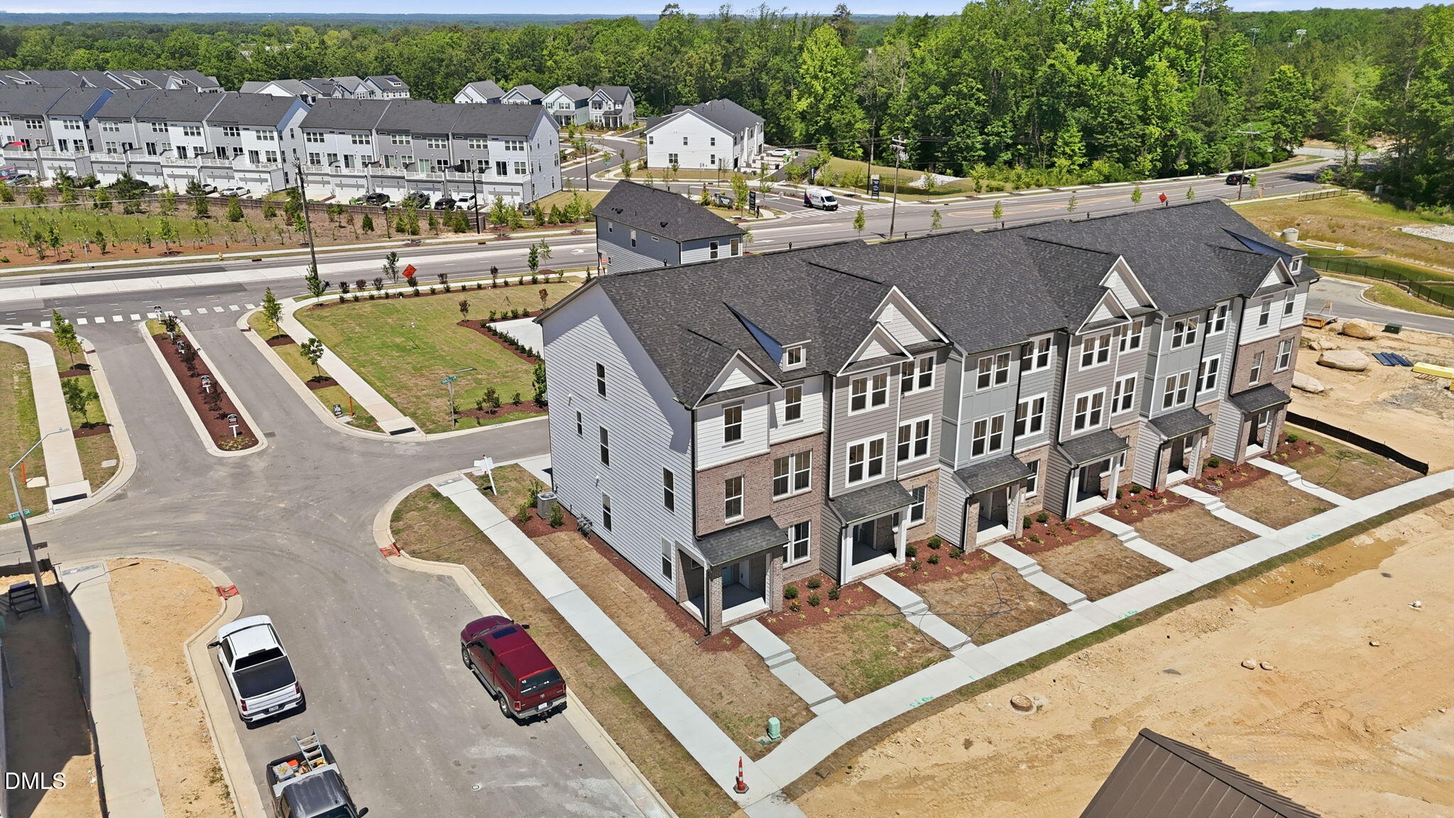 Aerial view of 3-story Avery floor plan townhomes by Davidson Homes at Forestville Yard in Knightdale, North Carolina.