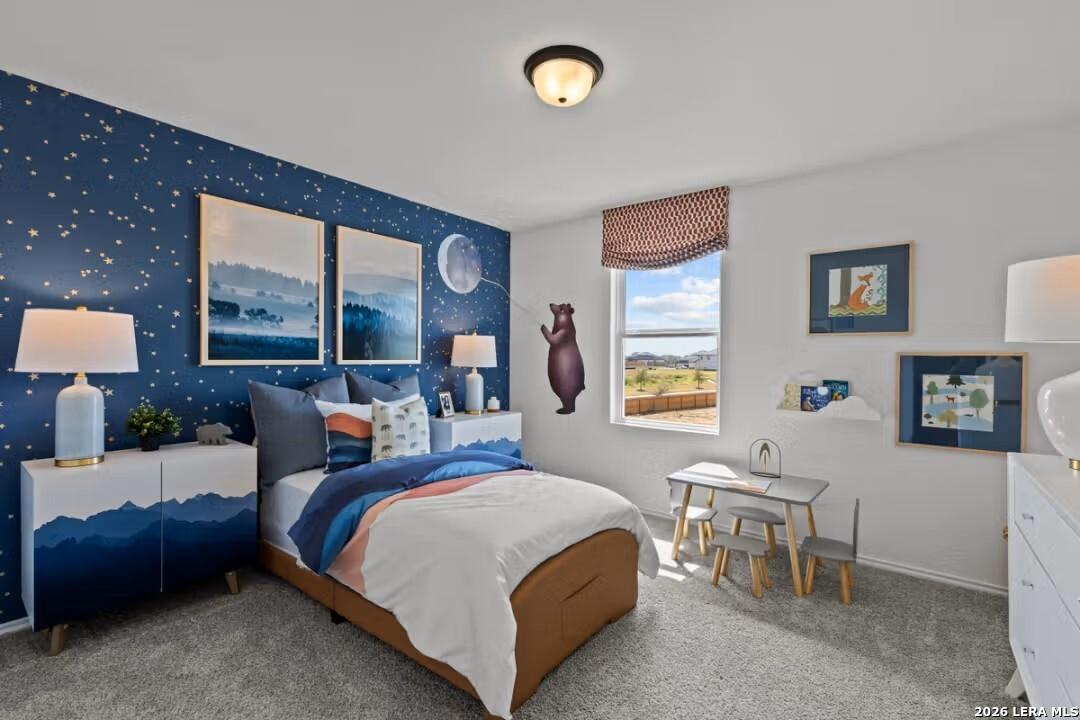Cozy kids' bedroom with starry navy walls, twin bed, desk, and mountain view in Davidson Homes The Douglas C, Converse, Texas