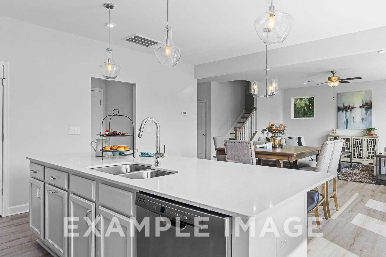 Davidson Homes The Chestnut Plan Kitchen Island overlooking the dining and living area