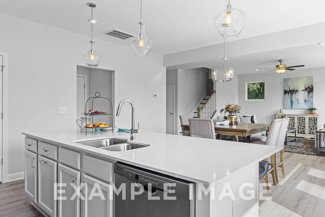 Davidson Homes The Chestnut Plan Kitchen Island overlooking the dining and living area