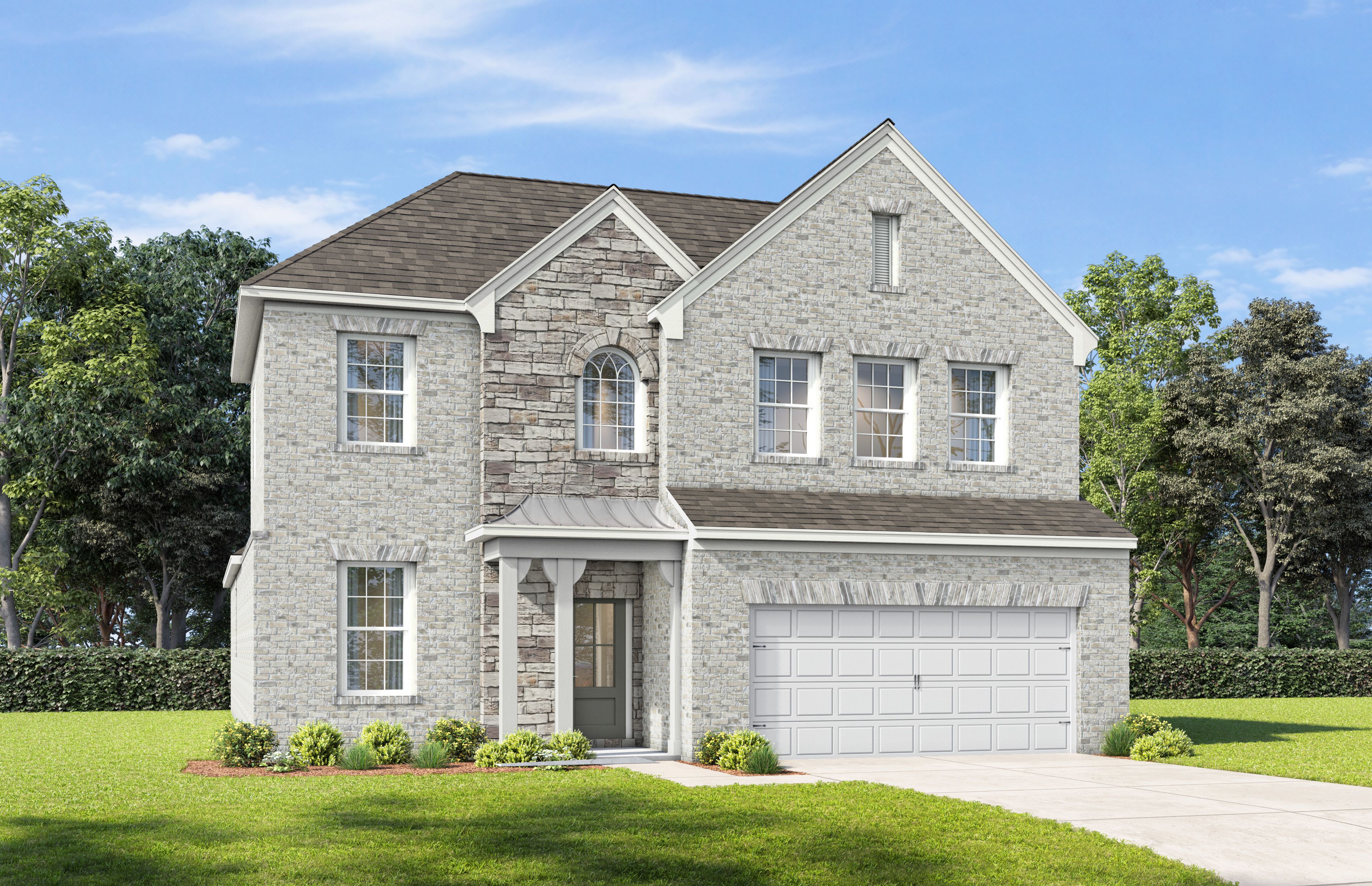 Craftsman-style exterior of The Ashport home design by Davidson Homes featuring stone accents and a spacious 2-car garage.