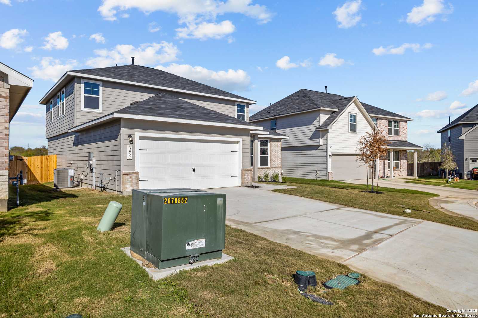 Modern 2-story Douglas B home exterior with 2-car garage and driveway in Horizon Pointe, Converse, Texas