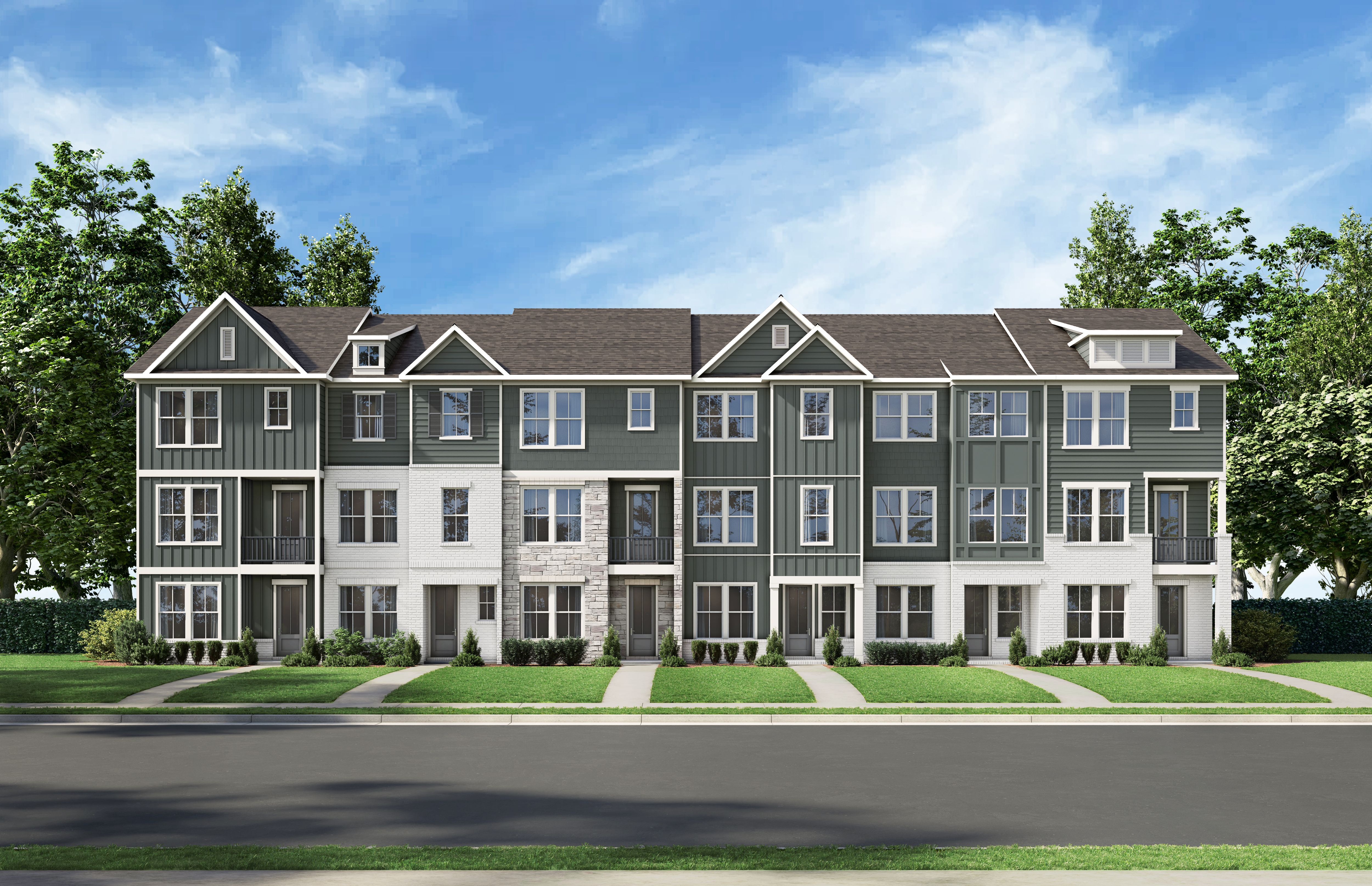Row of modern gray townhomes at Grafton Trace in Woodstock, Georgia with pitched roofs, large windows and green lawns