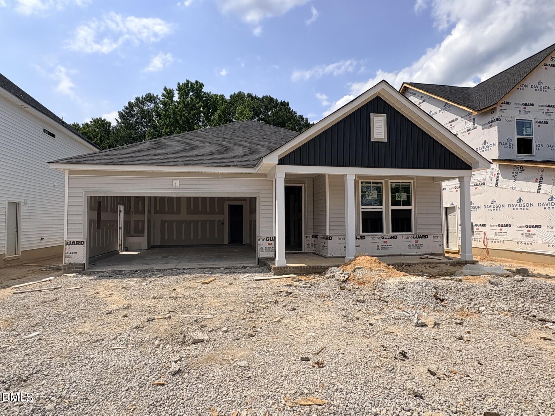 New construction of The Daphne D floor plan by Davidson Homes in Woodland Crossing, Zebulon, NC with a 2-car garage.