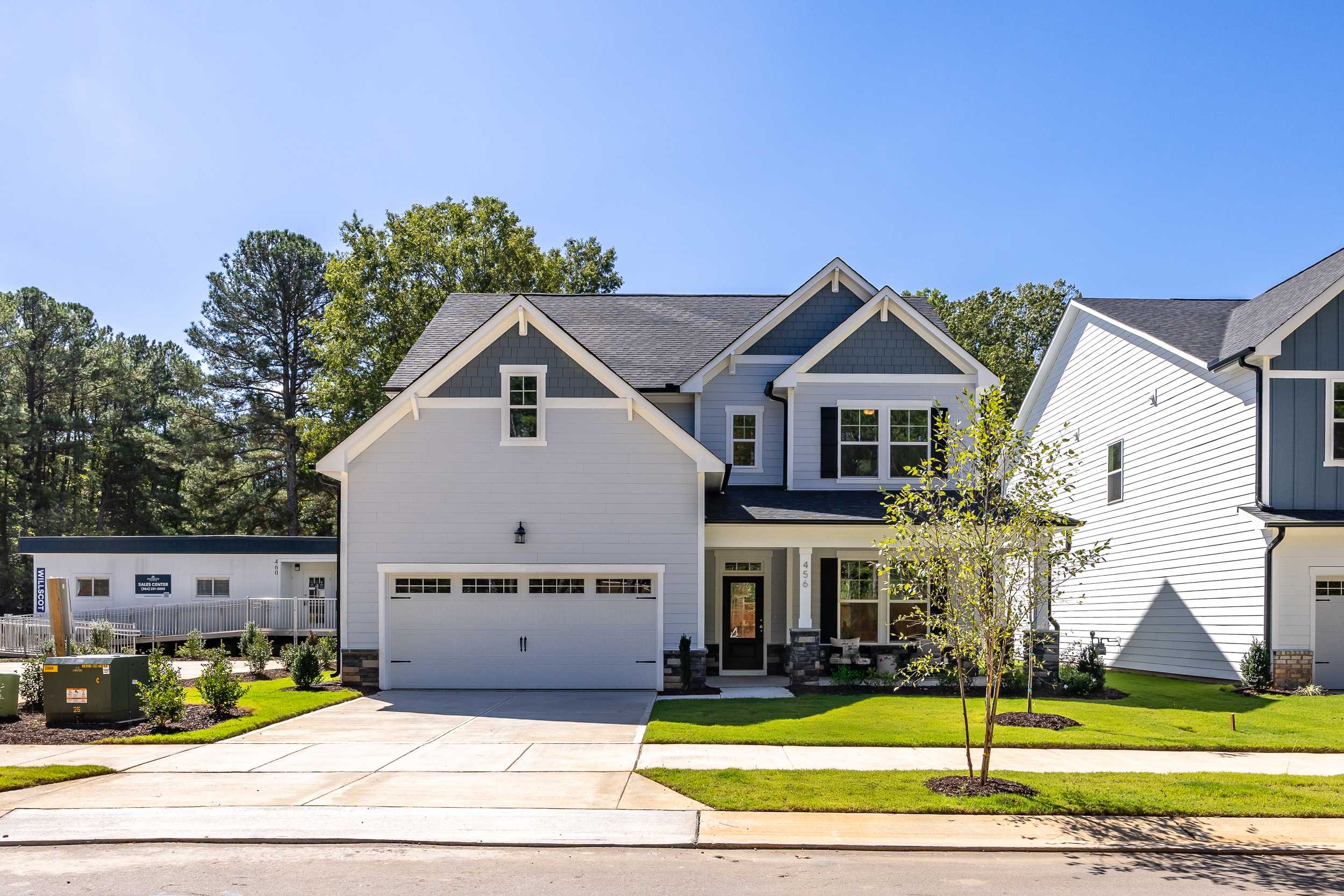 Modern craftsman homes at Sage on North Main in Wake Forest NC with garages, porches, and landscaped lawns