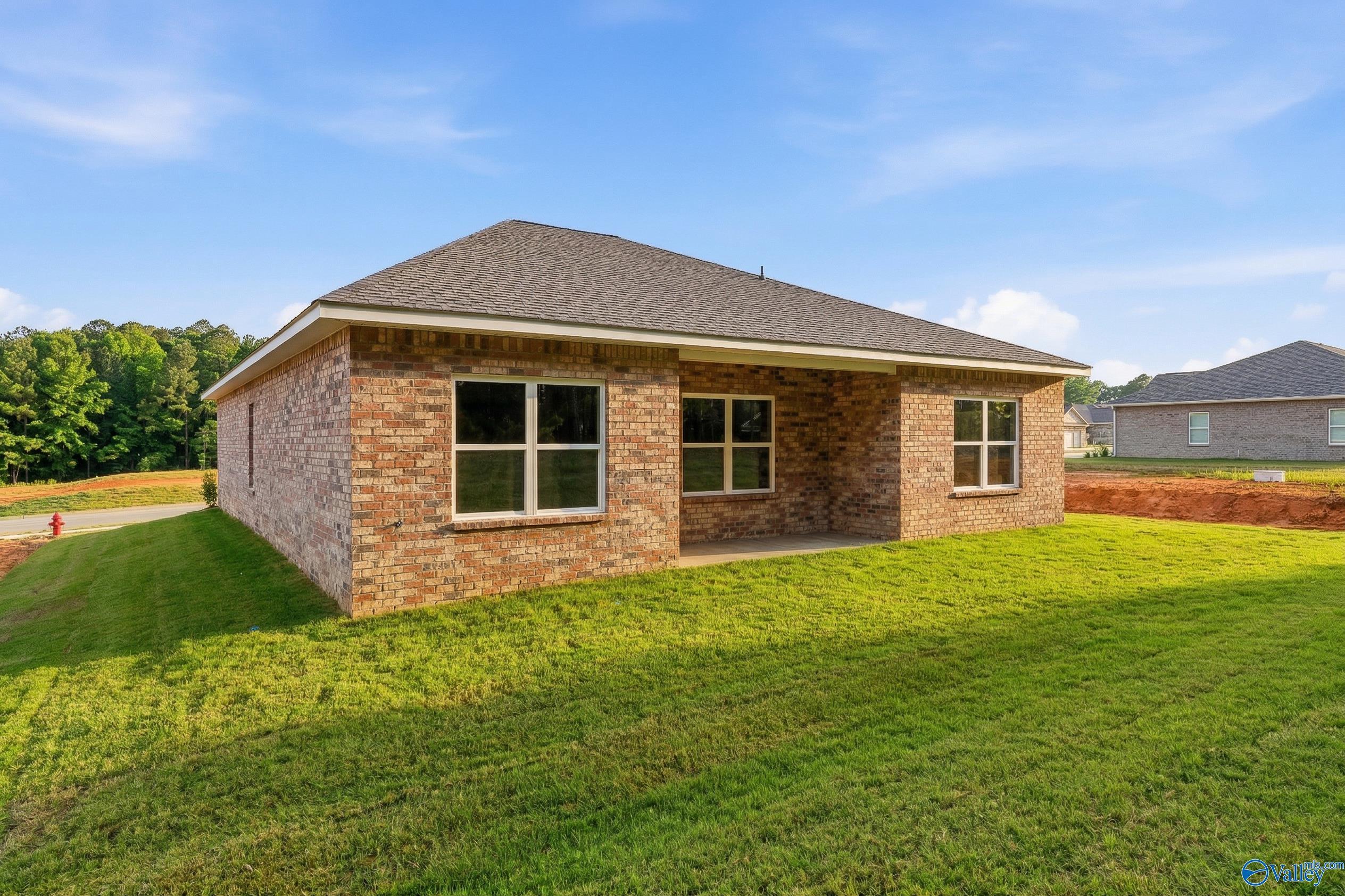 Rear exterior view of The Asheville C floor plan by Davidson Homes in The Highlands, Arab, Alabama.