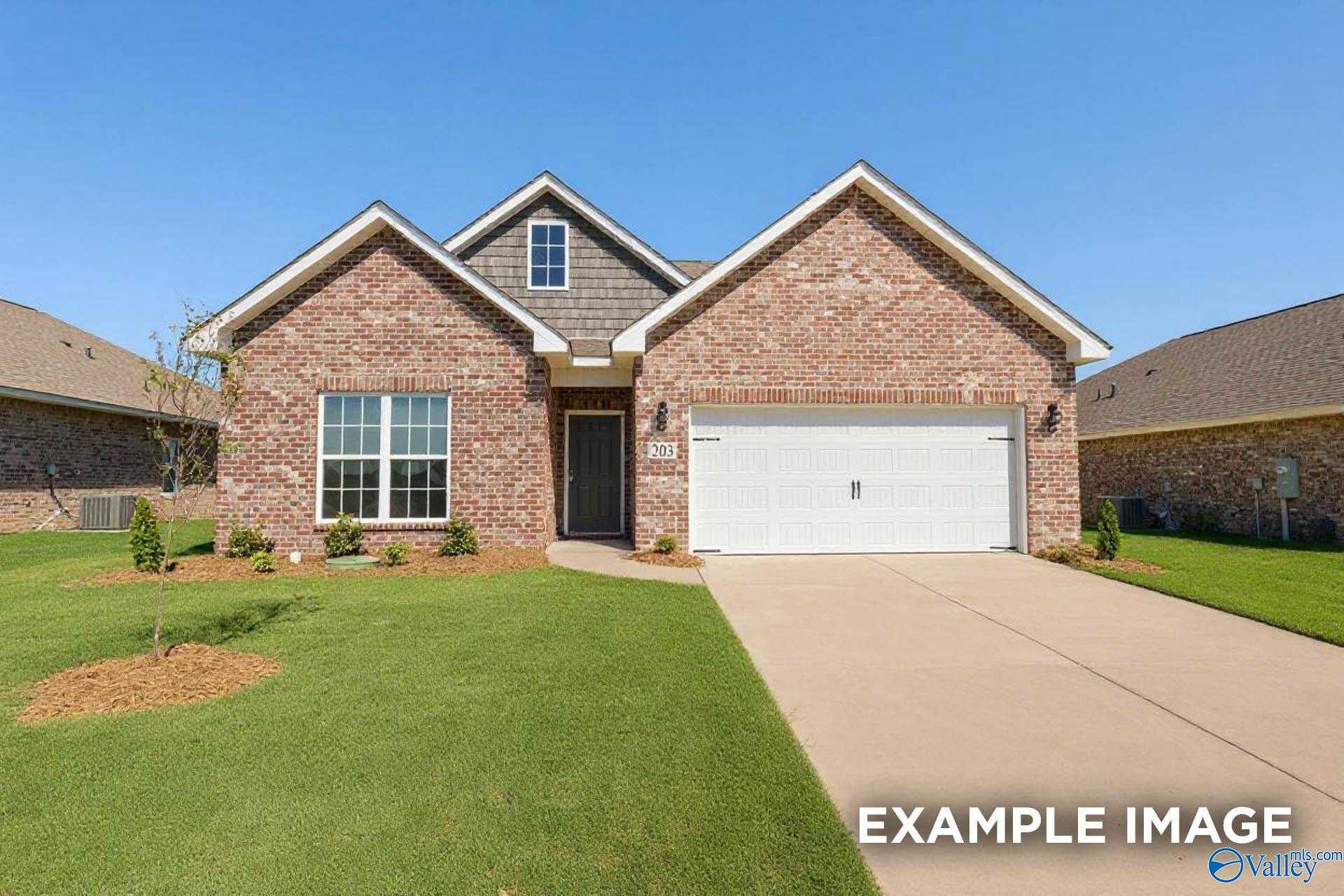 Brick single-story home with 2-car garage, manicured lawn, and shrubs in Ivy Hills, Toney, Alabama - Davidson Homes Franklin C