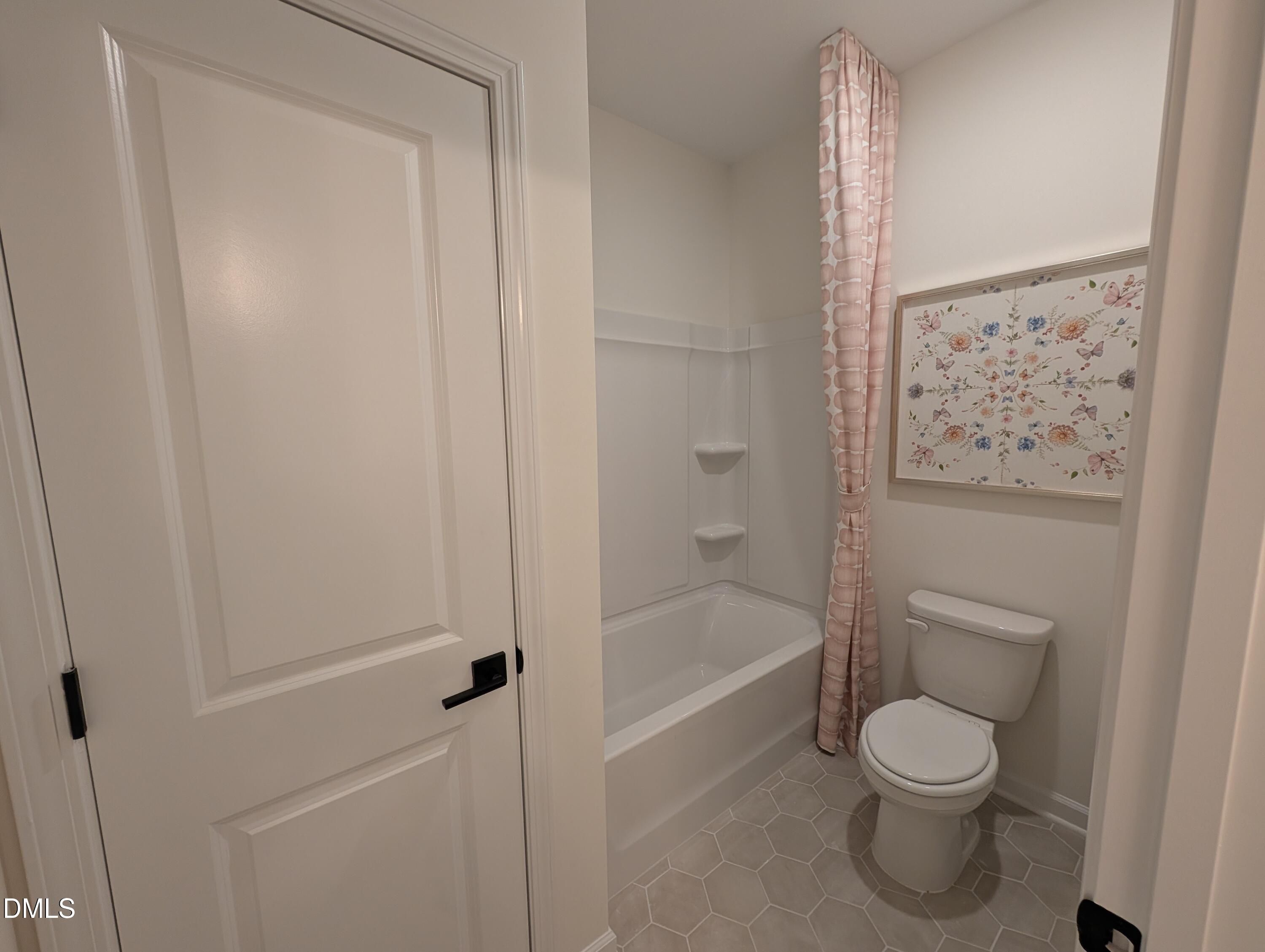Full bathroom with bathtub and shower combo in The Aspen B floor plan at Wendell Ridge, Wendell, North Carolina.