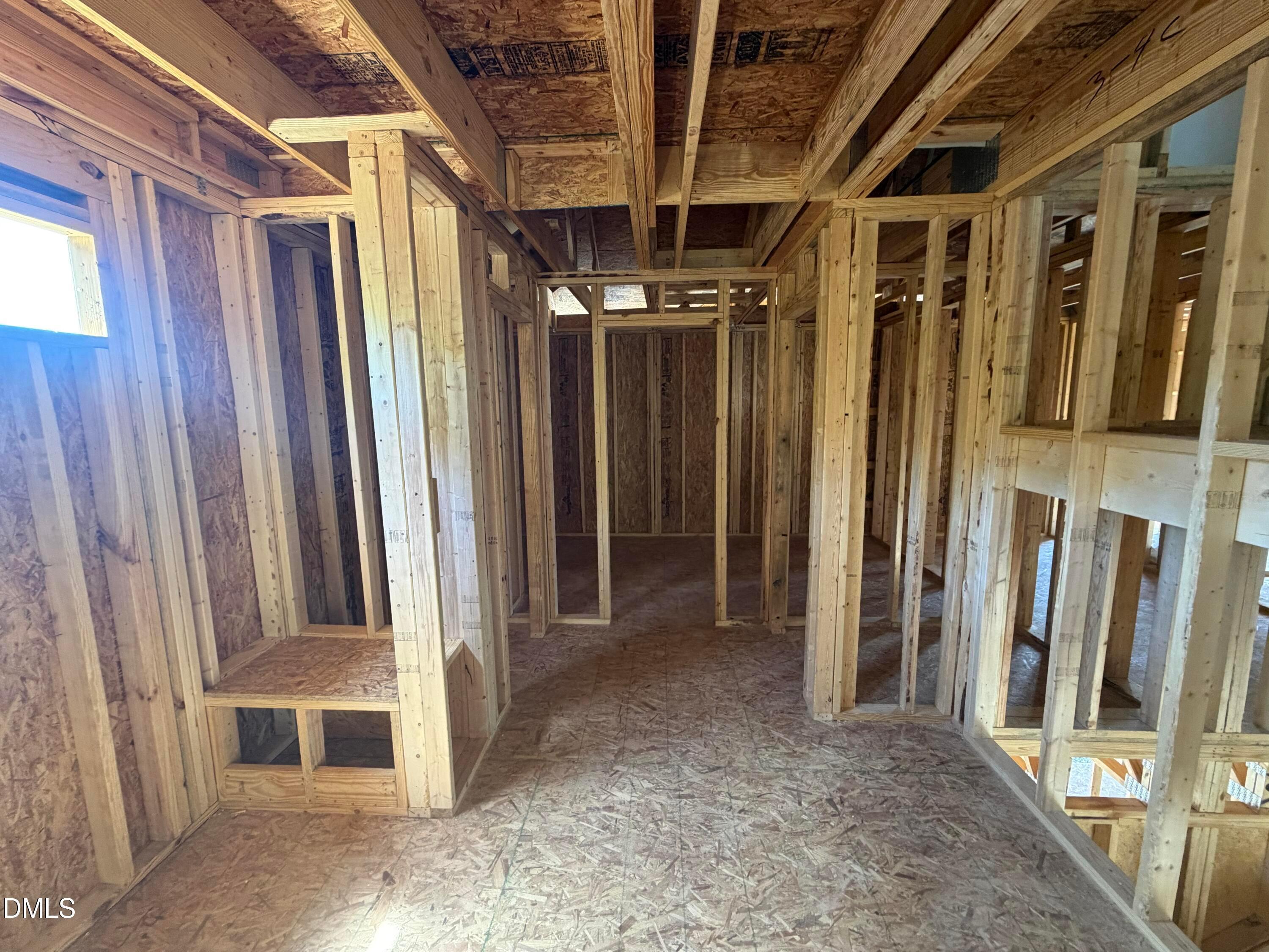 Exposed wooden framing with beams and studs in The Hickory II C 4-bedroom home by Davidson Homes, Wellers Knoll, Lillington, NC