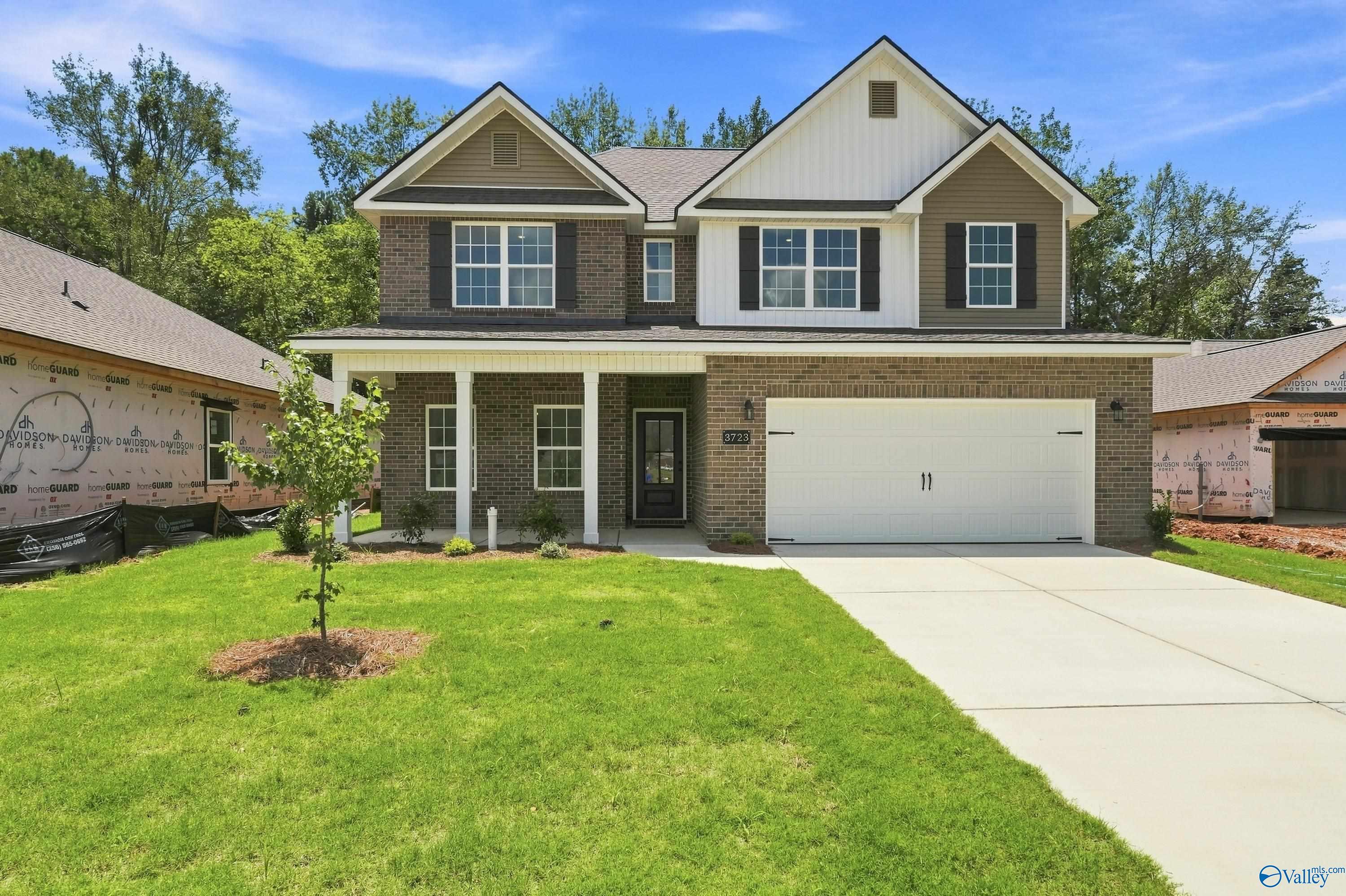 Two-story Shelby B floor plan by Davidson Homes with brick exterior, 2-car garage in Jaguar Hills, Huntsville, Alabama.