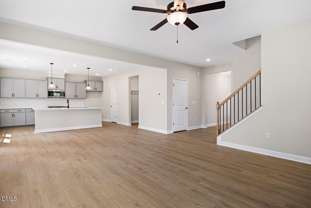 Open-concept living room and kitchen in The Chestnut floor plan by Davidson Homes, Montrose, Aberdeen, North Carolina.