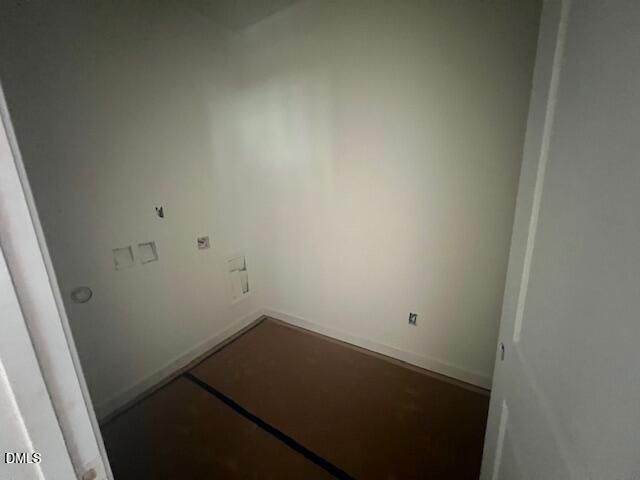 Empty bedroom with fresh white walls and subfloor in new construction Davidson Homes Magnolia II B plan, Lillington NC