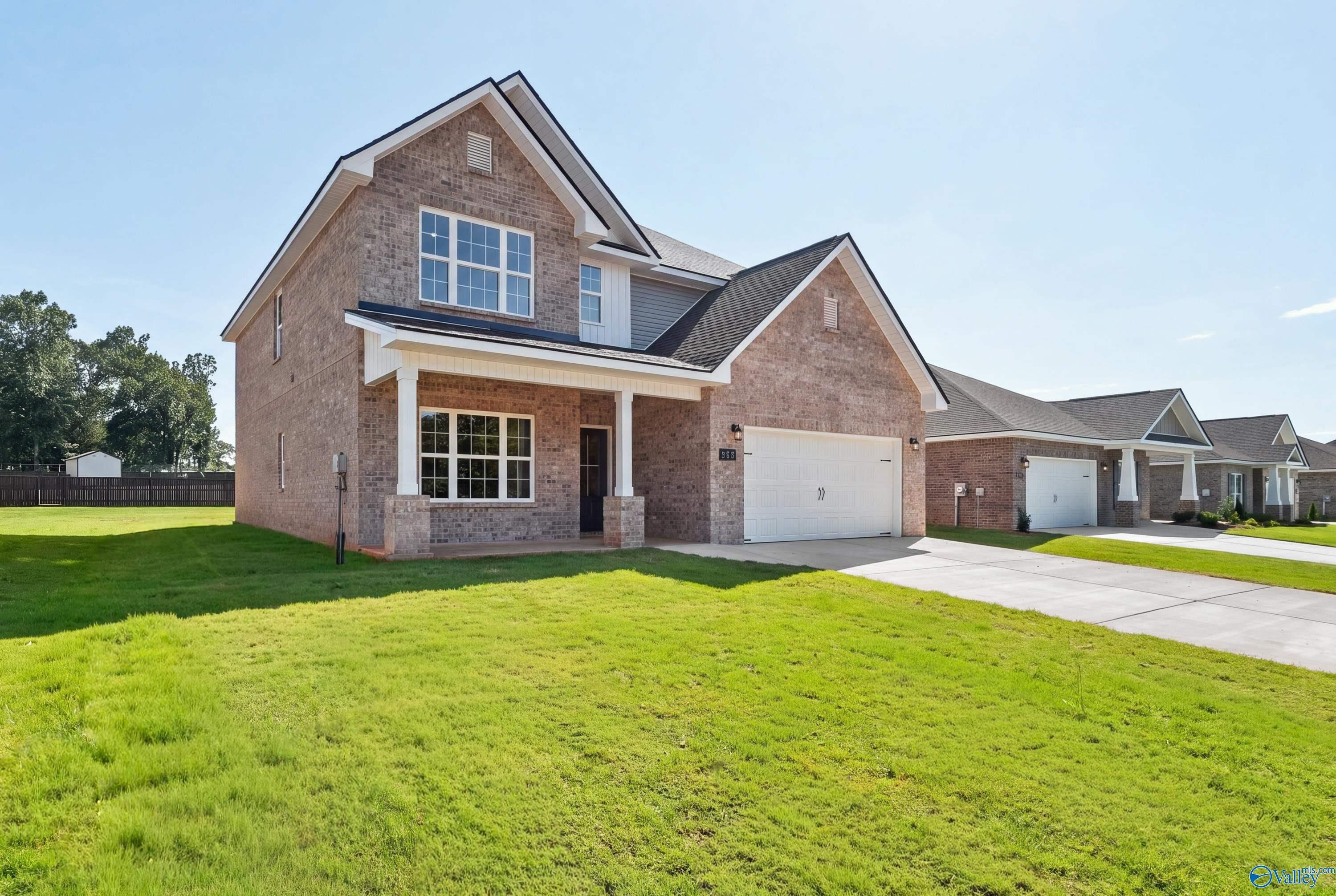Two-story brick 4-bedroom home with covered porch and 2-car garage in Creek Grove, New Market, Alabama by Davidson Homes