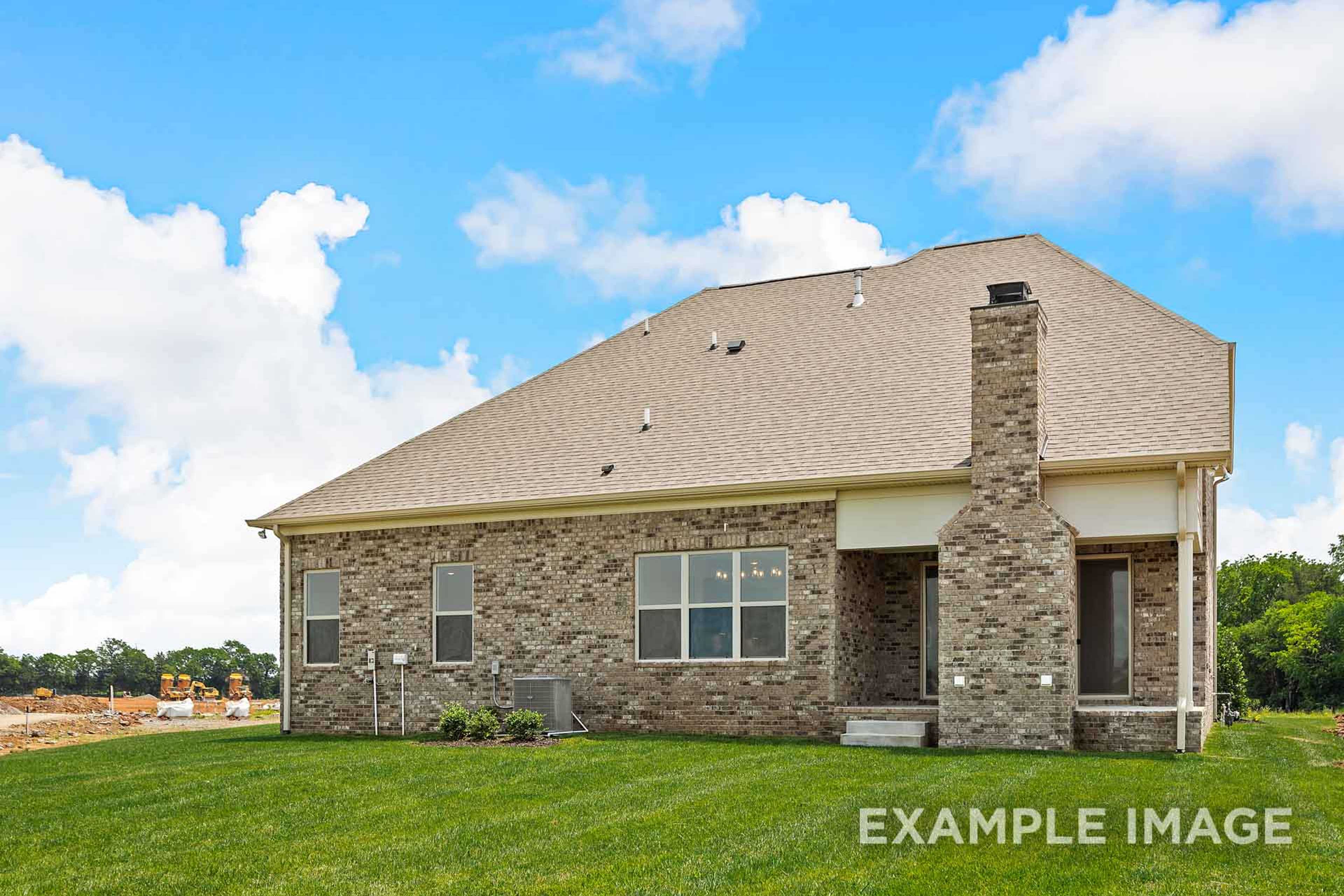 Two-story Hawkins home elevation by Davidson Homes: brick accents, siding exterior, chimney, and covered patio in Murfreesboro, TN