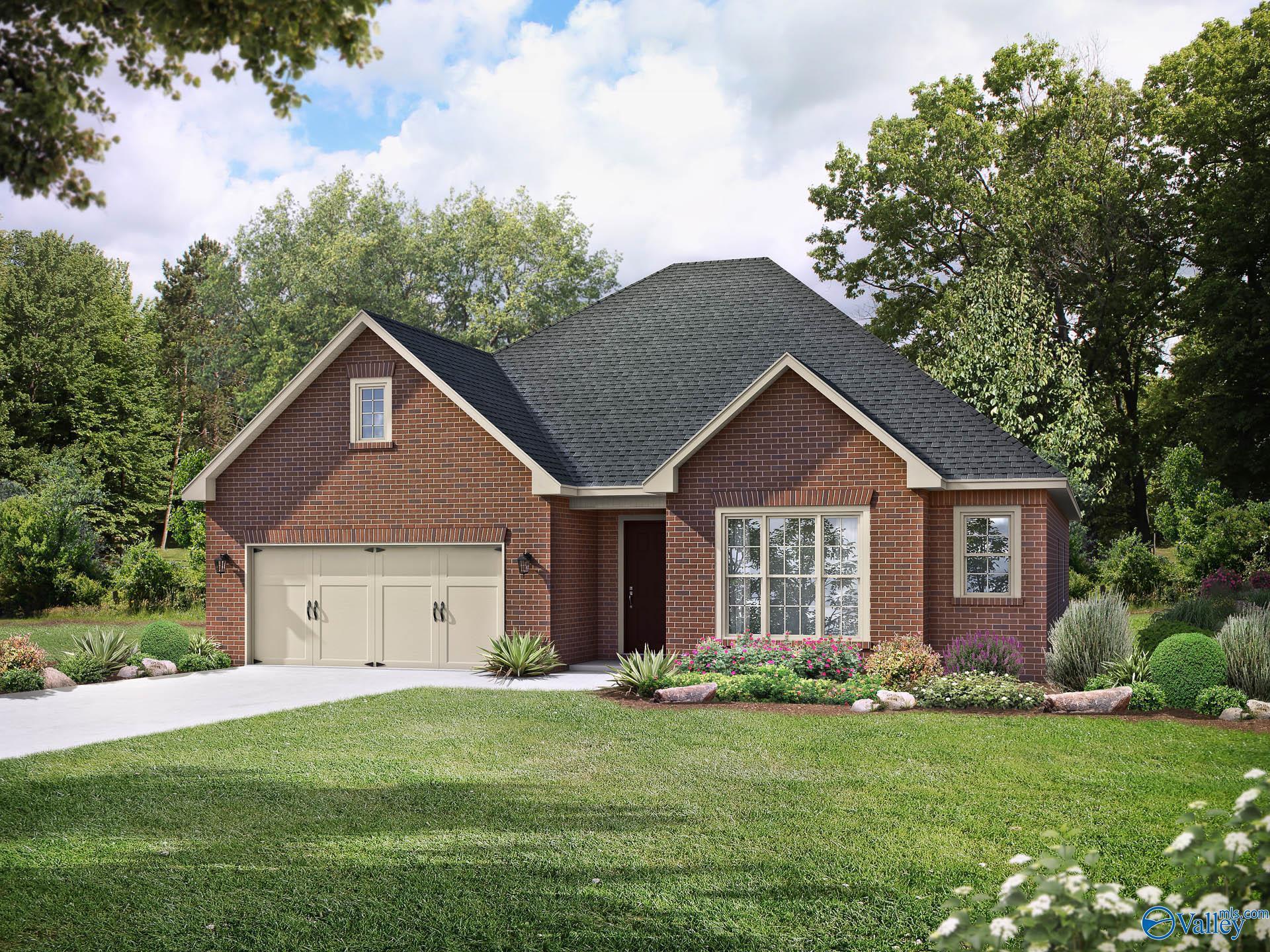 Brick exterior of The Montgomery C floor plan by Davidson Homes with 3-car garage in Pikes Ridge, Meridianville, Alabama.