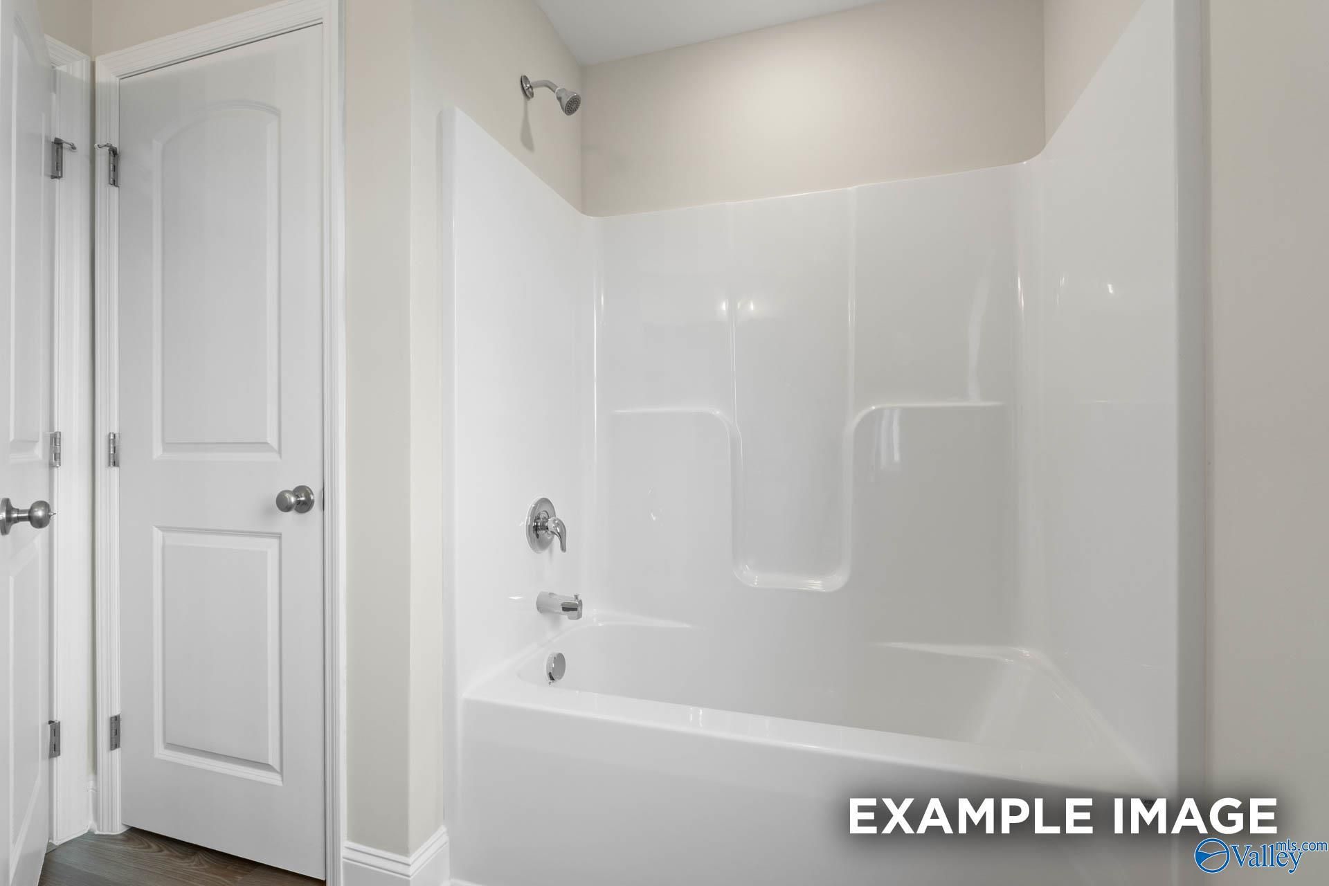 White bathtub and shower combo in The Shelby B floor plan by Davidson Homes in Jaguar Hills, Huntsville, Alabama.