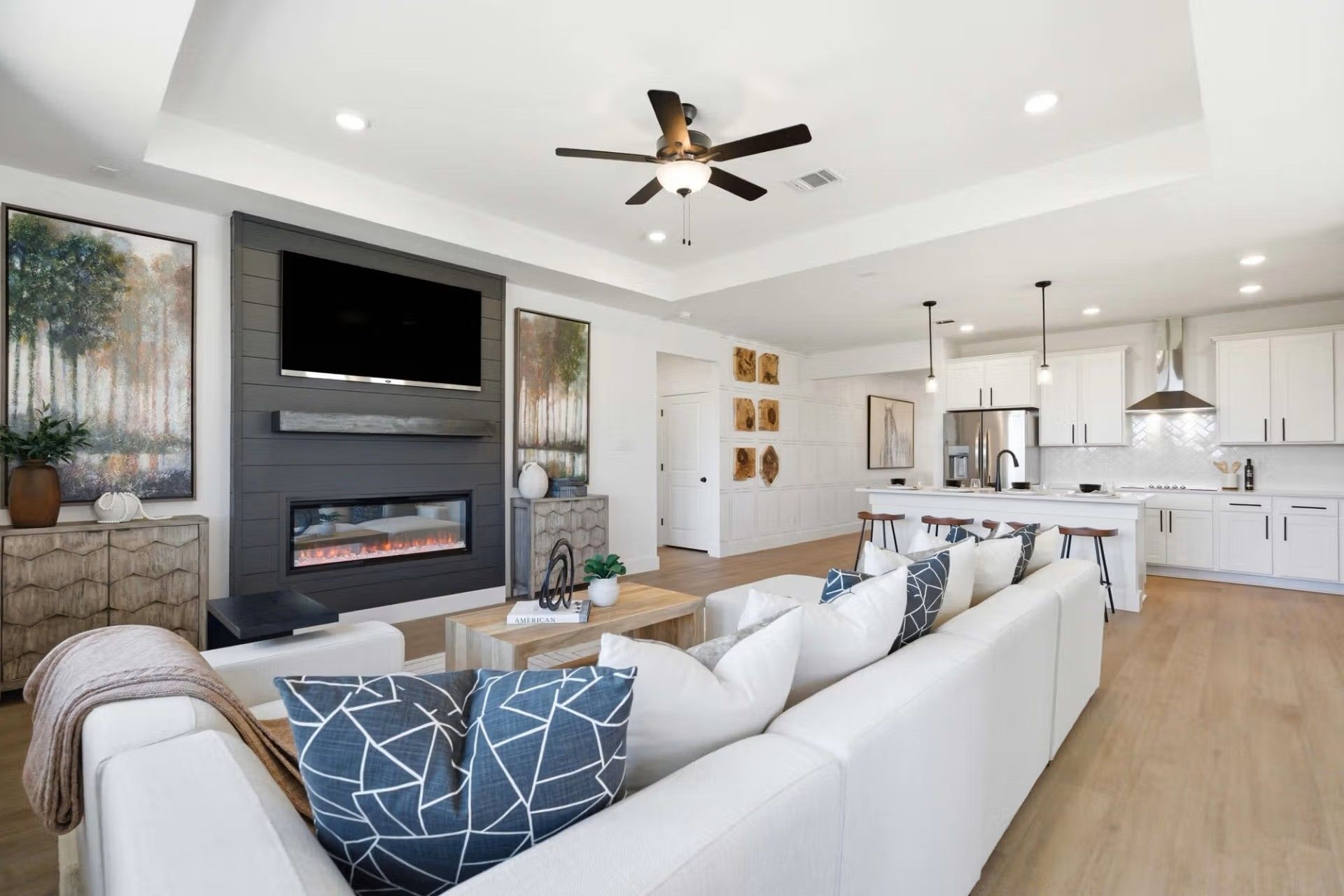 Open-concept living room and kitchen in The Laurel O floor plan by Davidson Homes at Mercer Meadows in Royse City, Texas.