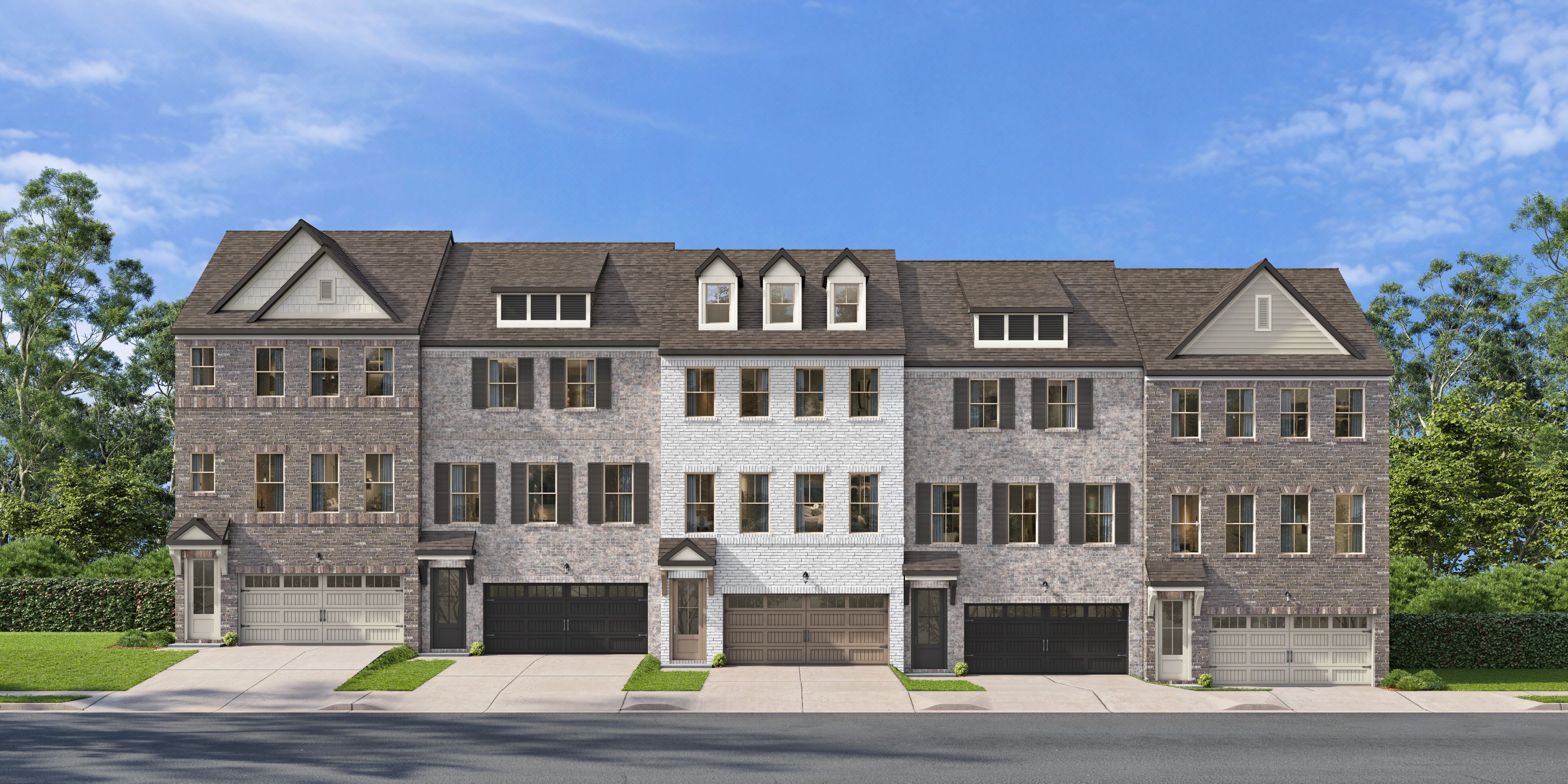 Multi-story brick townhome exterior at Jackson Village in Hendersonville, Tennessee, built by Davidson Homes.