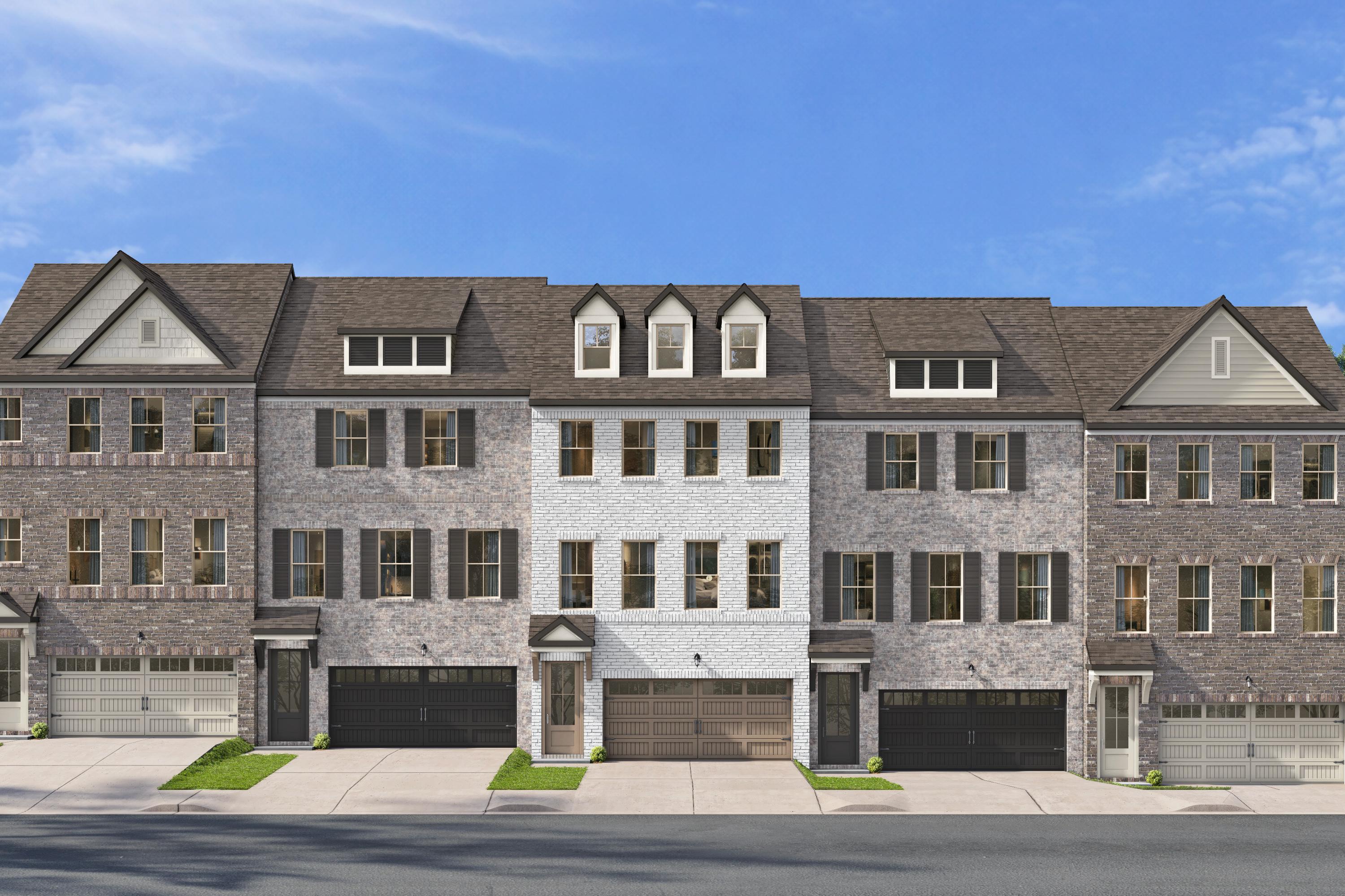 Multi-story brick townhome exterior at Jackson Village in Hendersonville, Tennessee, built by Davidson Homes.
