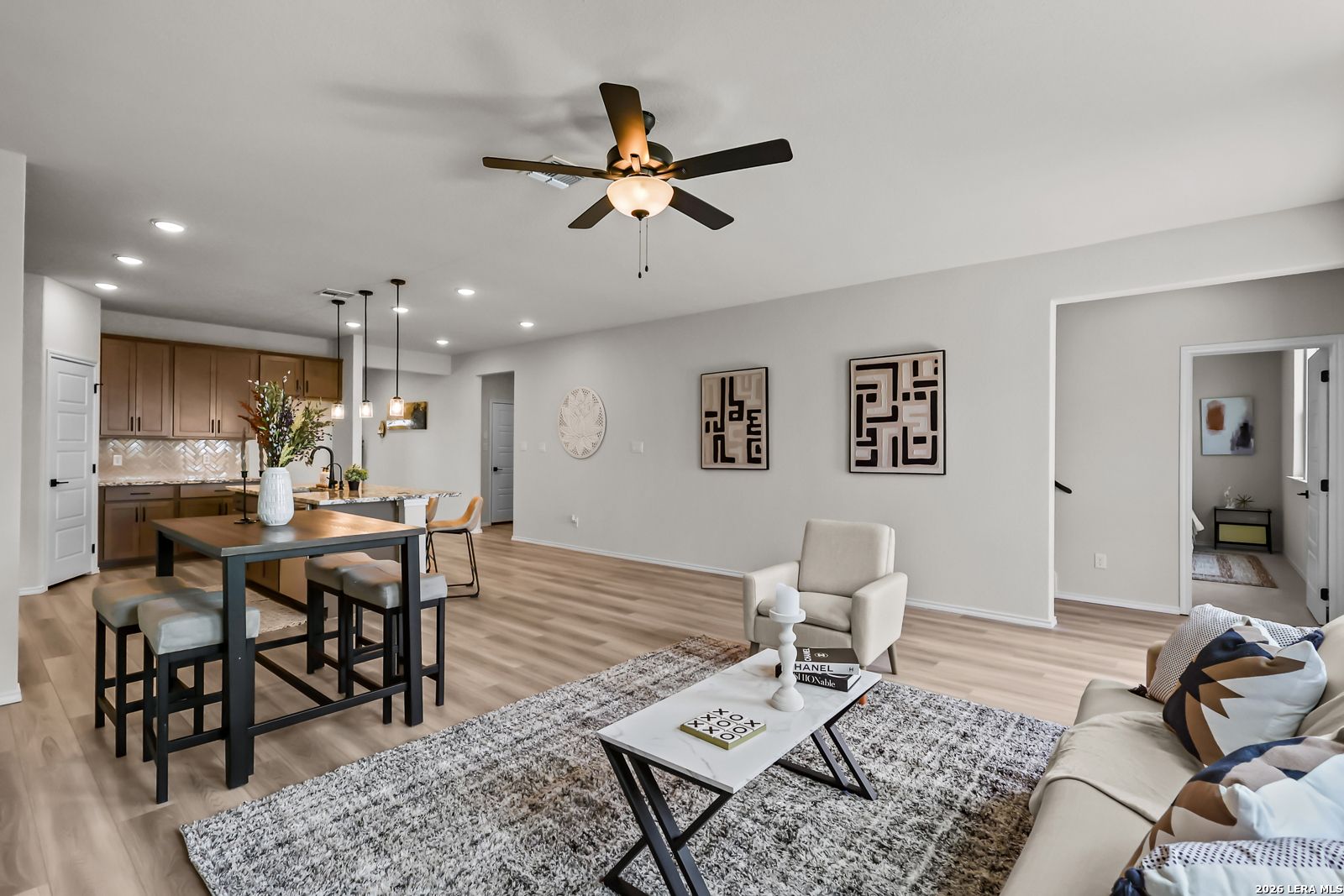 Open-concept living room and kitchen in The Douglas C floor plan at Hannah Heights in Seguin, Texas.