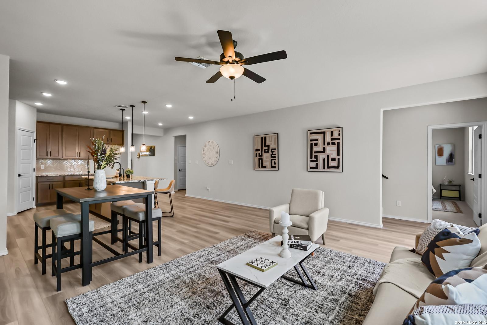 Open-concept living room and kitchen in The Douglas C floor plan at Hannah Heights in Seguin, Texas.