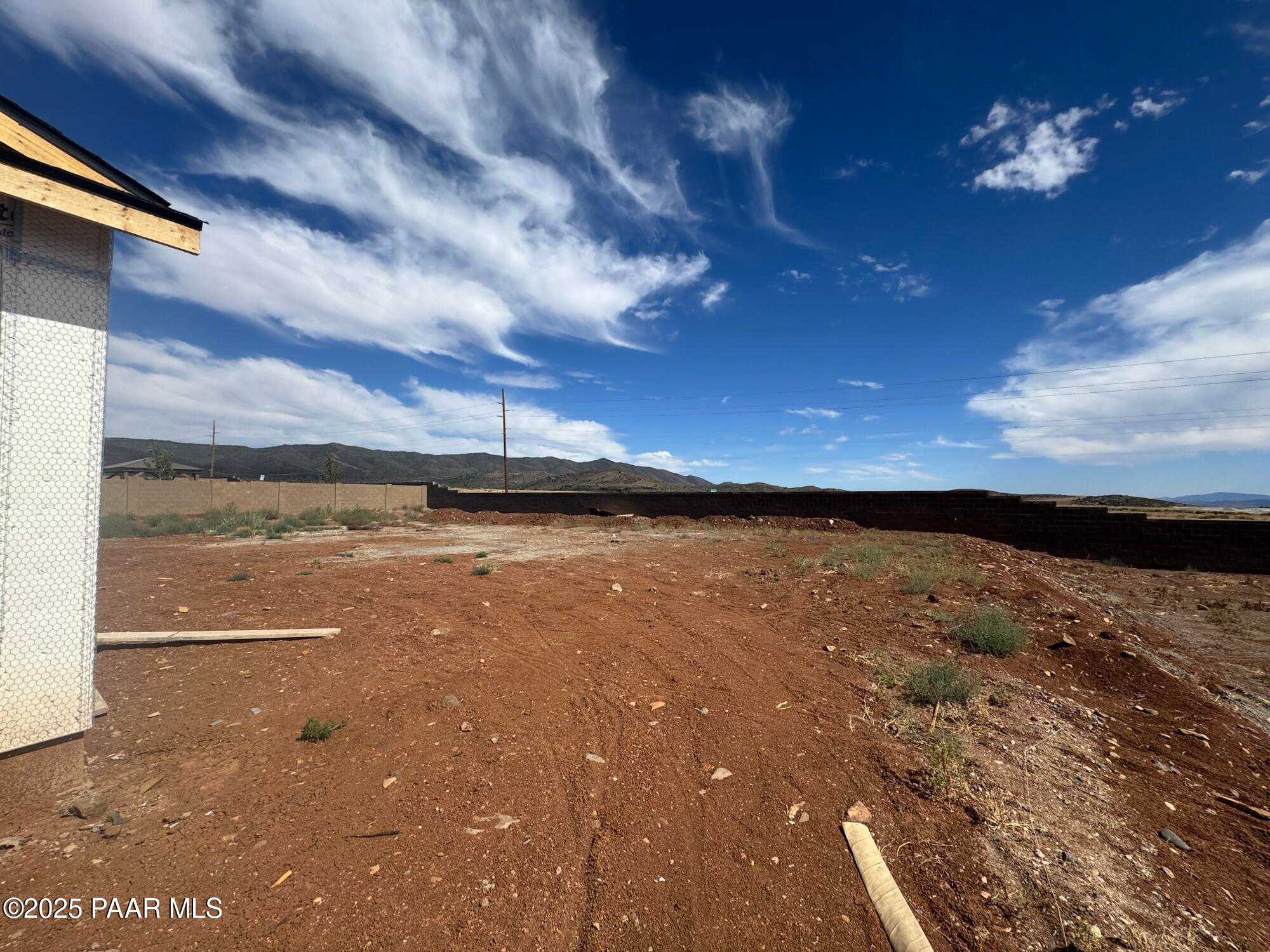 Partially framed 3-bedroom single-story home under construction with mountain views in Morningstar, Prescott Valley, Arizona