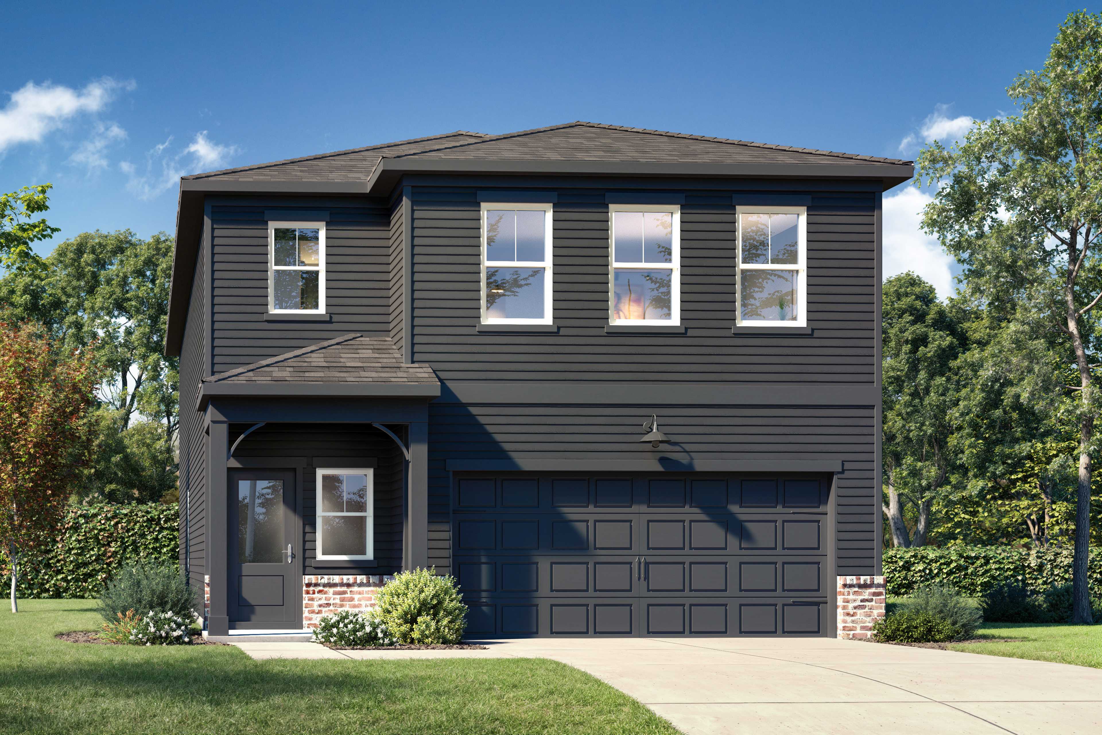 Modern two-story Sinclair A home elevation with dark siding, covered porch, two-car garage, and lush landscaping in Winder, GA