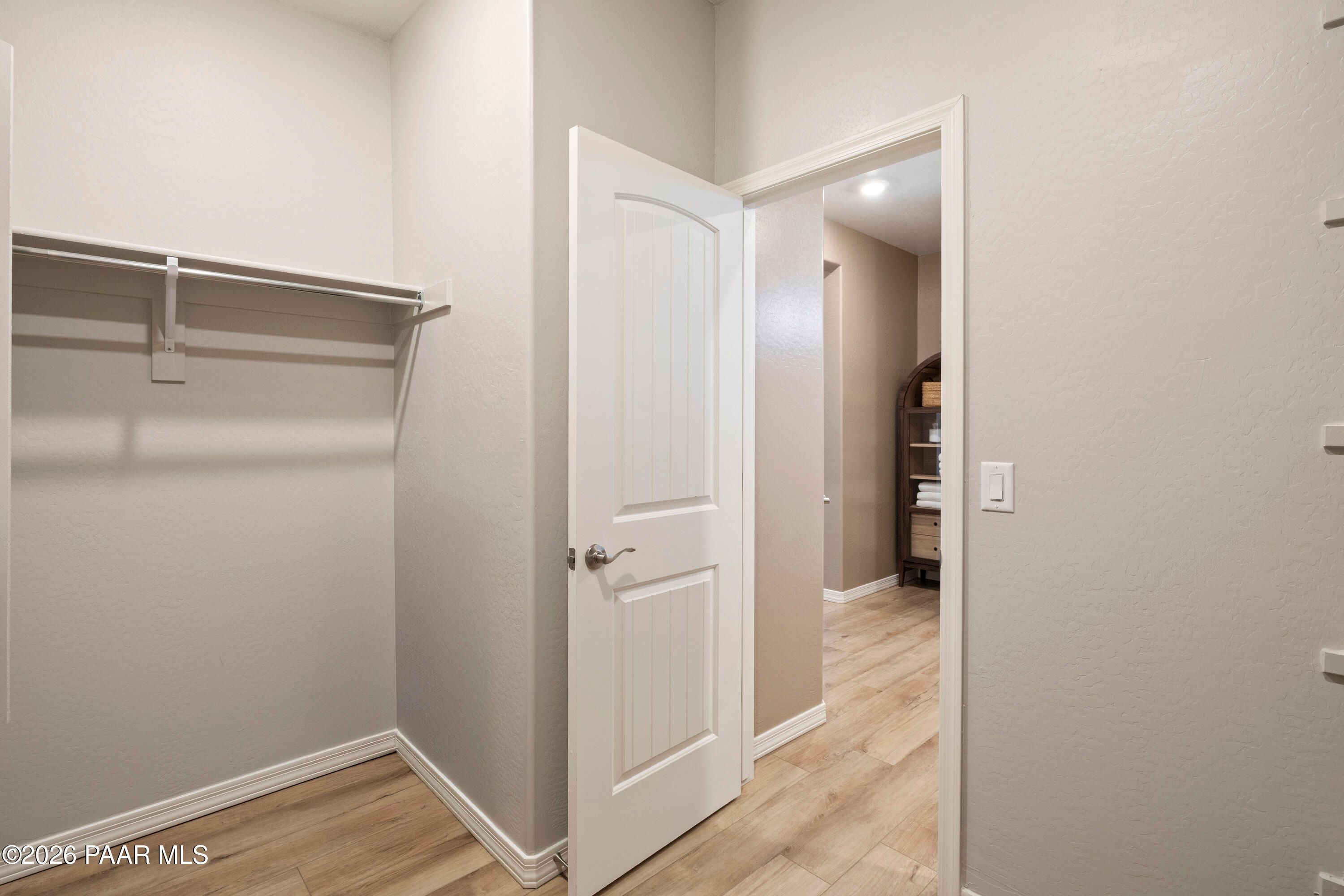 Walk-in closet with shelving in The Harmony A floor plan at Pronghorn Ranch, Prescott Valley, Arizona.