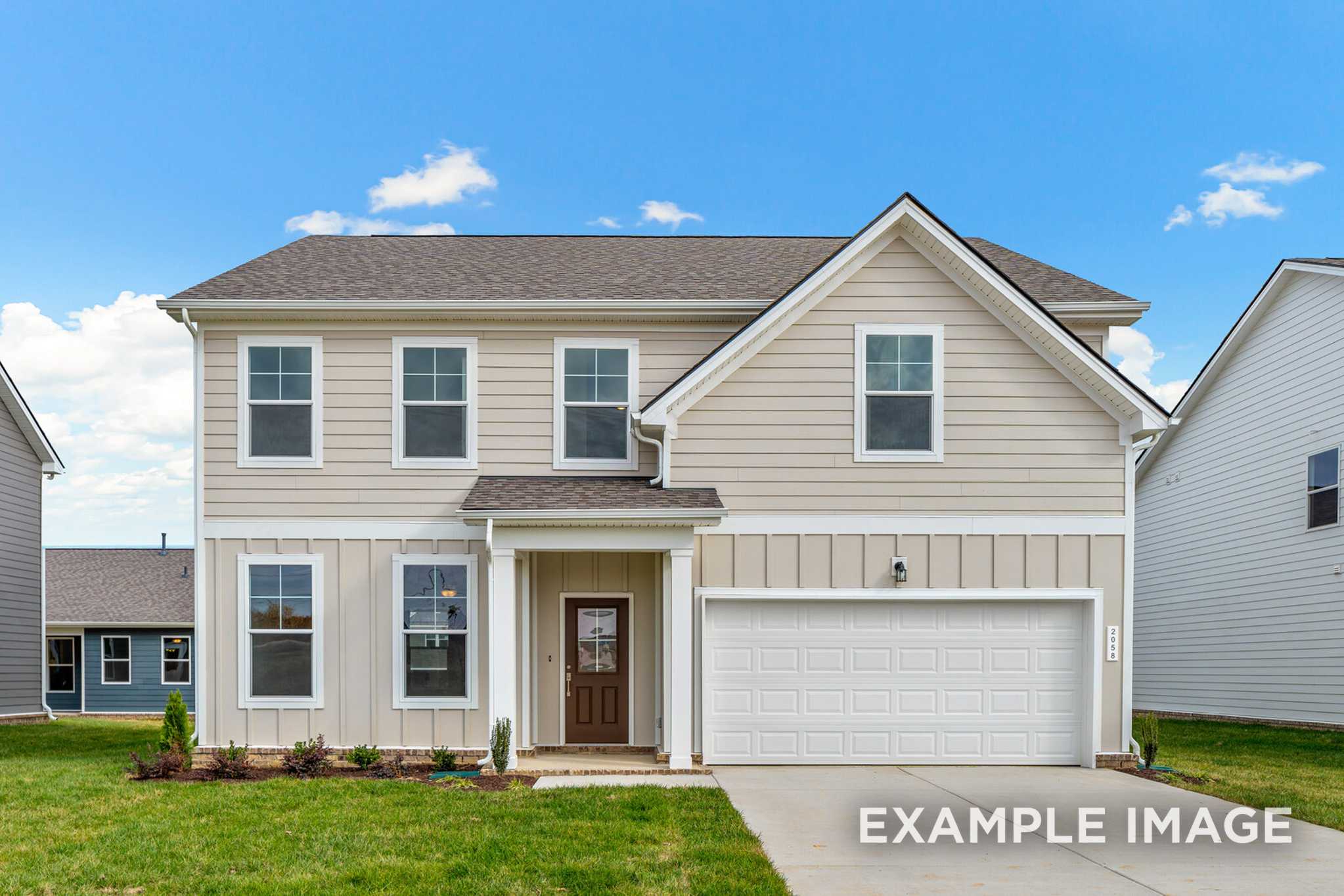 Two-story beige craftsman home, The Murray A by Davidson Homes, with two-car garage, covered porch, and landscaped yard in White House, TN