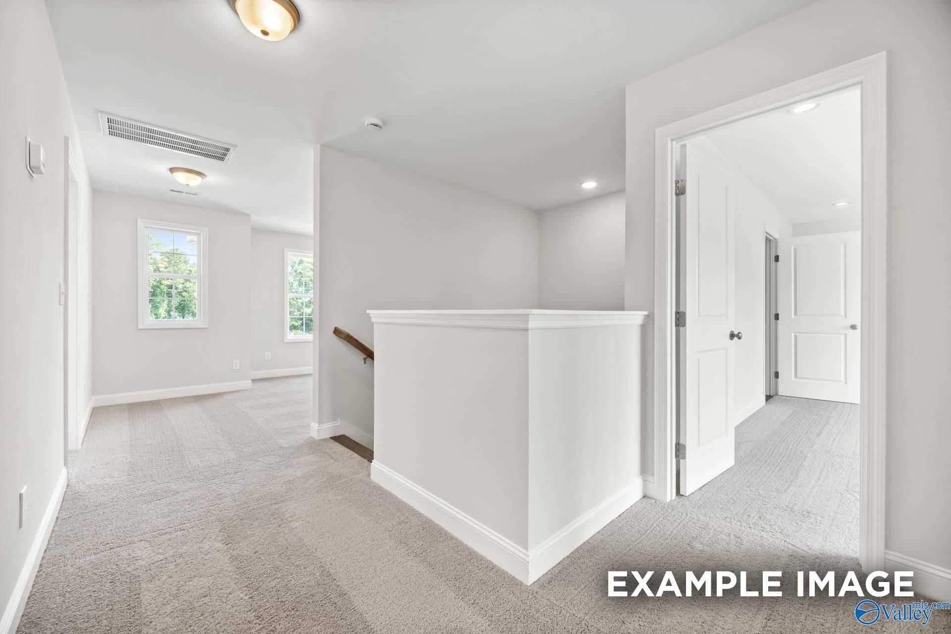 Bright upstairs landing and hallway in The Shelby B floor plan by Davidson Homes in Jaguar Hills, Huntsville, Alabama.