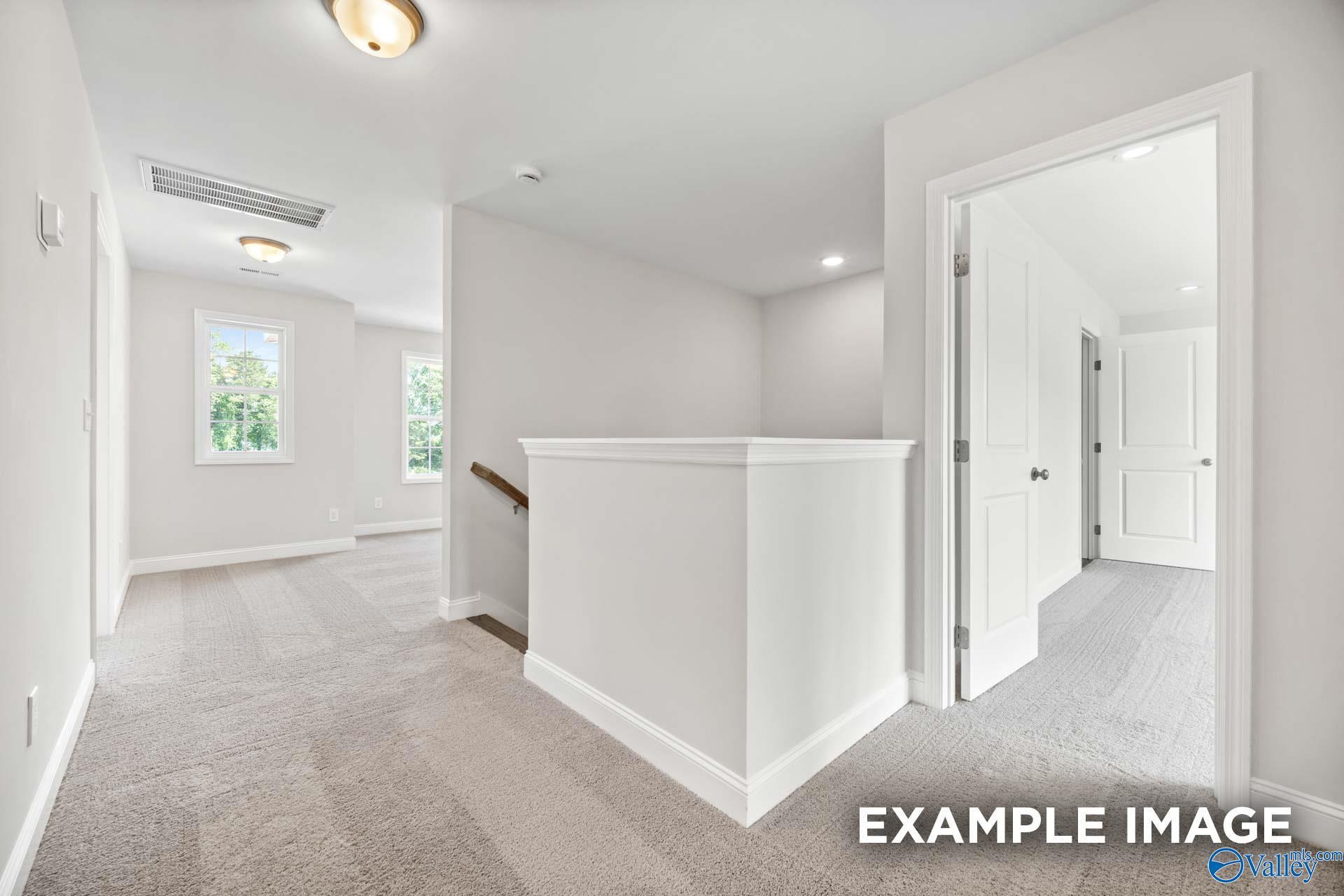Bright upstairs landing and hallway in The Shelby B floor plan by Davidson Homes in Jaguar Hills, Huntsville, Alabama.