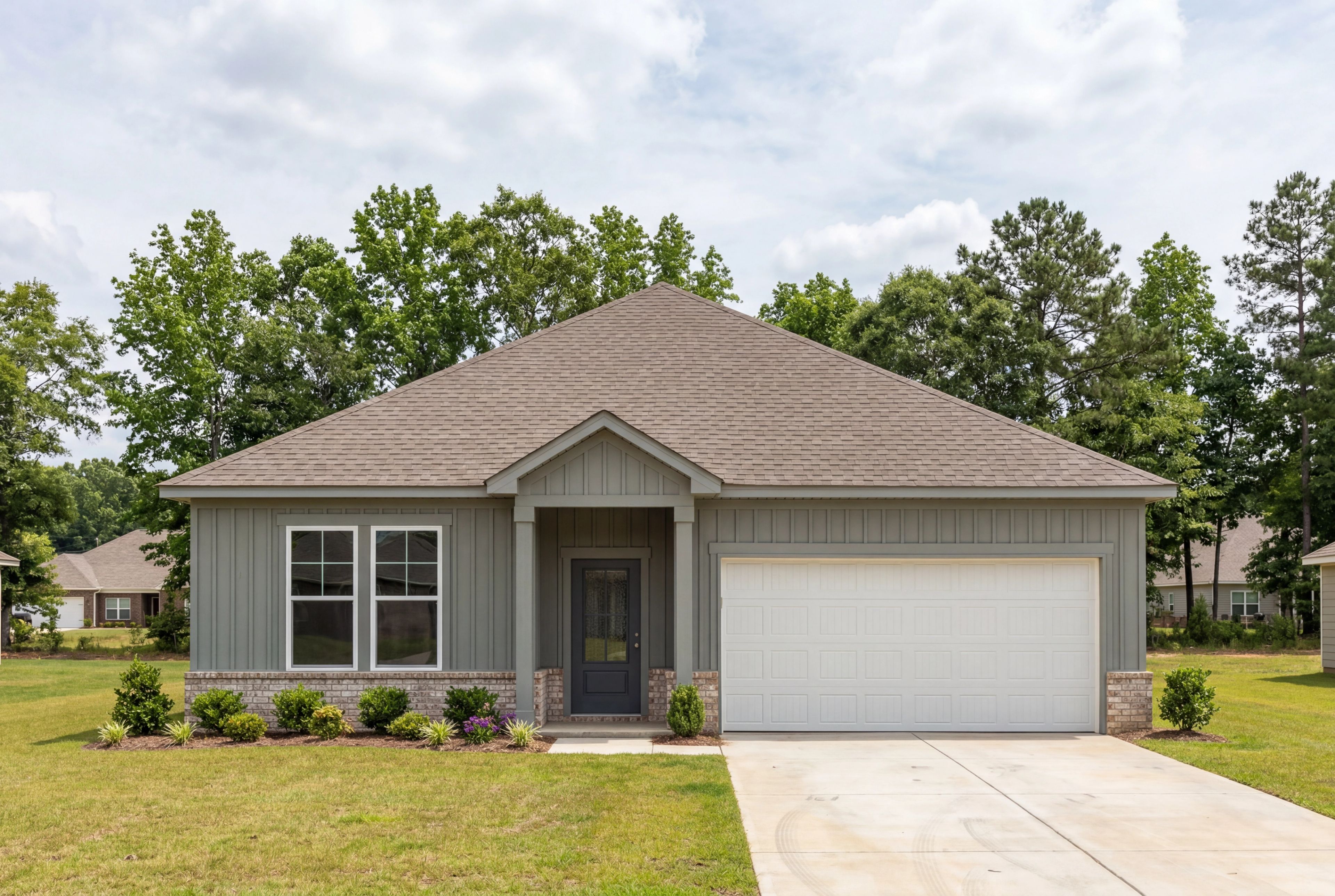 The Laurel J single-family home in Cullman, Alabama features a 1-story design with cement-concrete siding and 2-car garage.