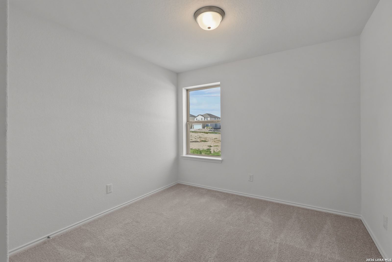 Bright, neutral-toned bedroom in The Brazos B floor plan by Davidson Homes in Agave, San Antonio, Texas.