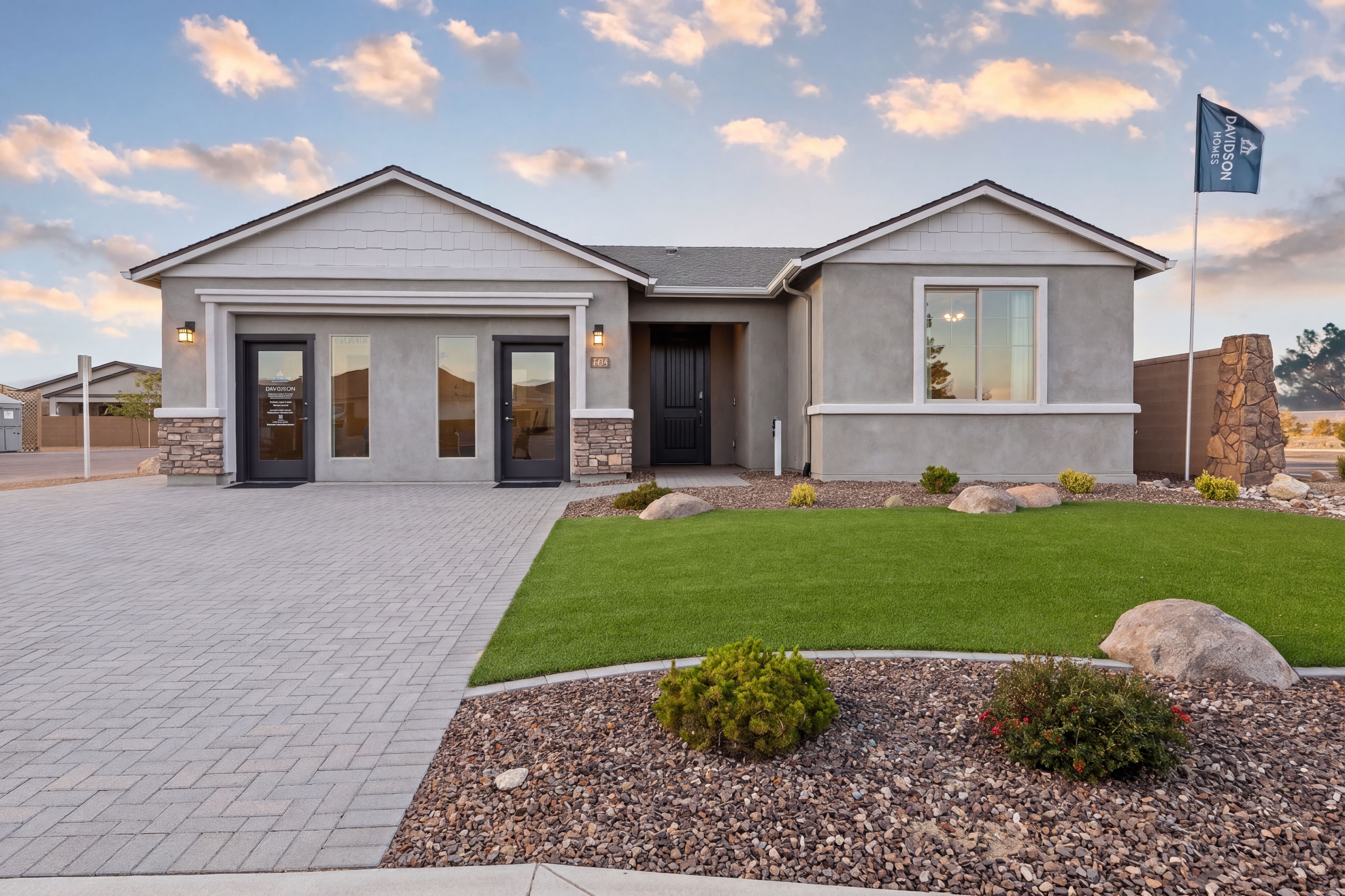 Davidson Homes sales center at North Ridge Pronghorn Ranch Prescott Valley AZ with modern stucco exterior, paver driveway, and desert landscaping