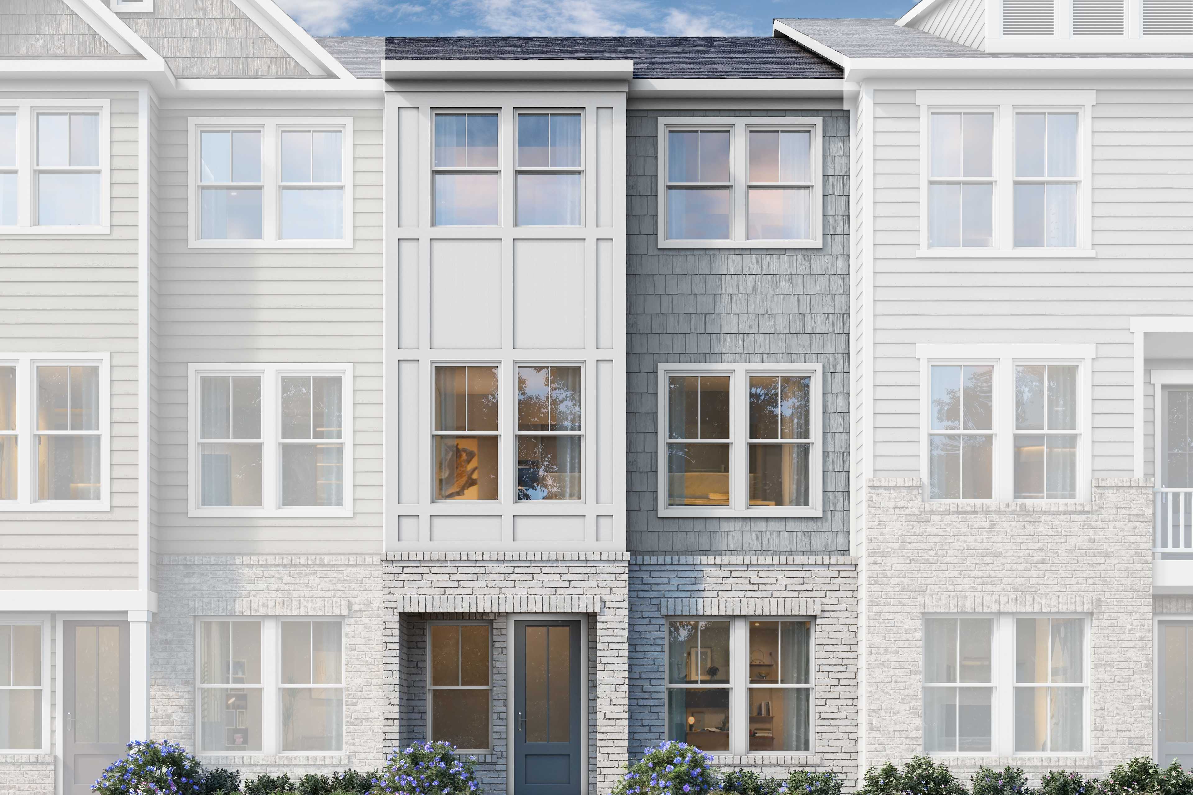 Modern 3-story townhome elevation of The Lincoln C with white siding, gray accents, brick base, and landscaped front yard in Woodstock, GA