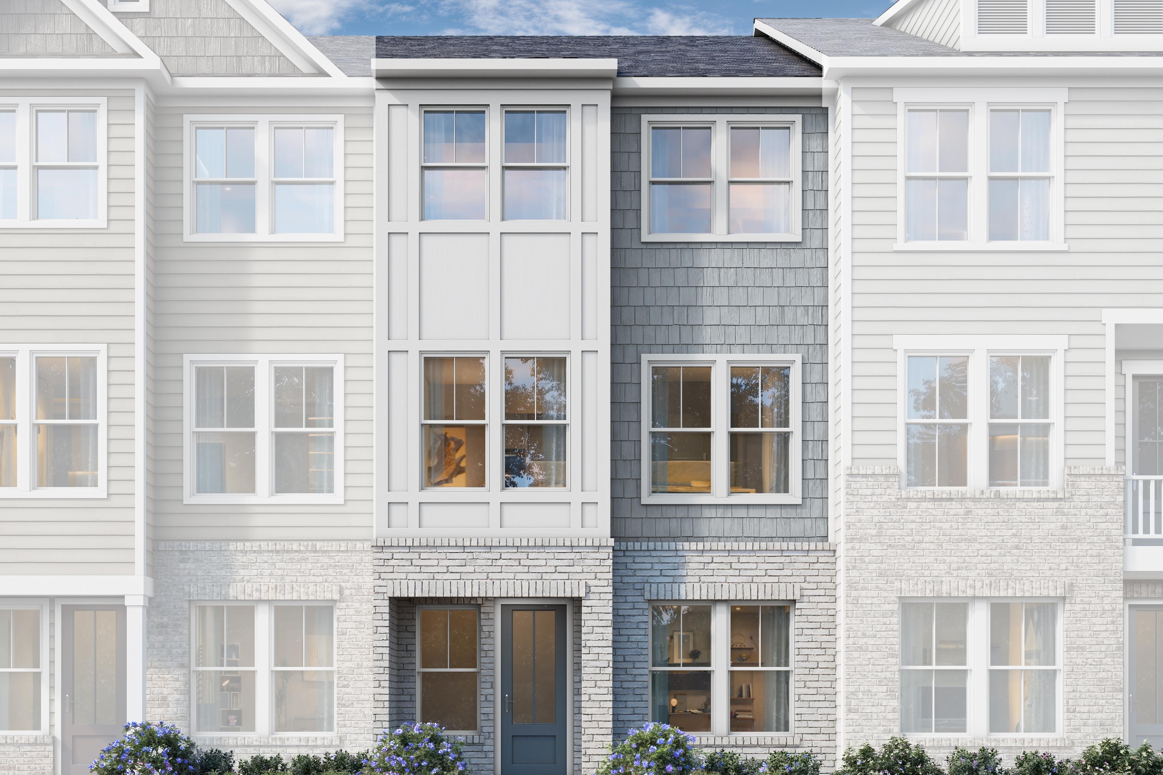 Modern 3-story townhome elevation of The Lincoln C with white siding, gray accents, brick base, and landscaped front yard in Woodstock, GA