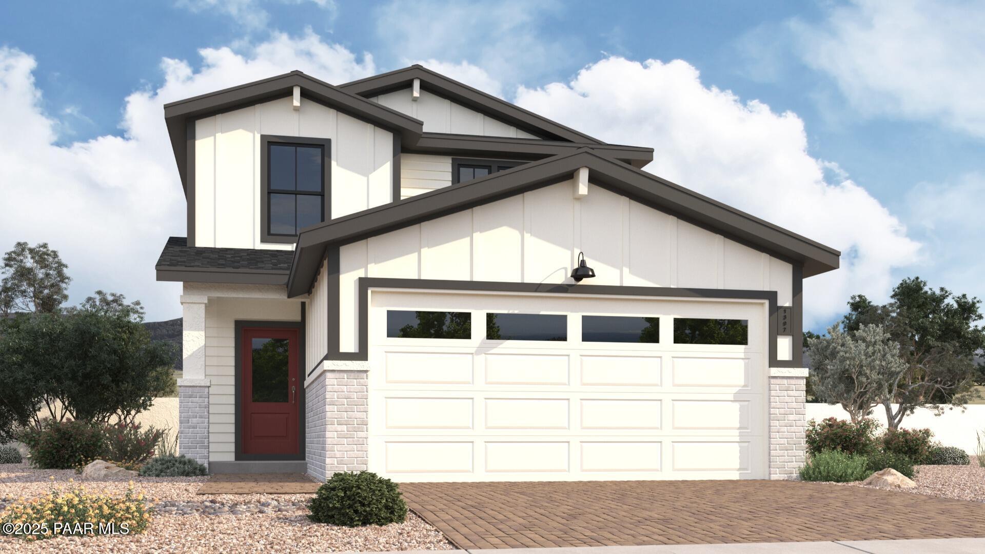Modern 2-story Wilmington B home with white siding, black trim, red door, 3-car garage, and desert landscaping in Prescott, Arizona