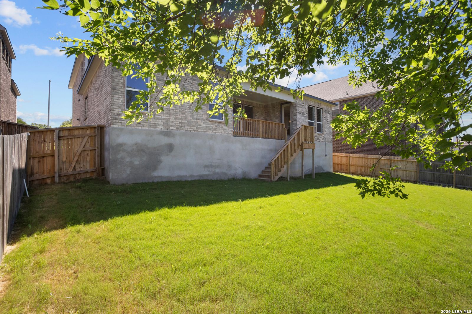 Elevated wooden deck and backyard of The Jennings G floor plan by Davidson Homes in Ladera, San Antonio, Texas.