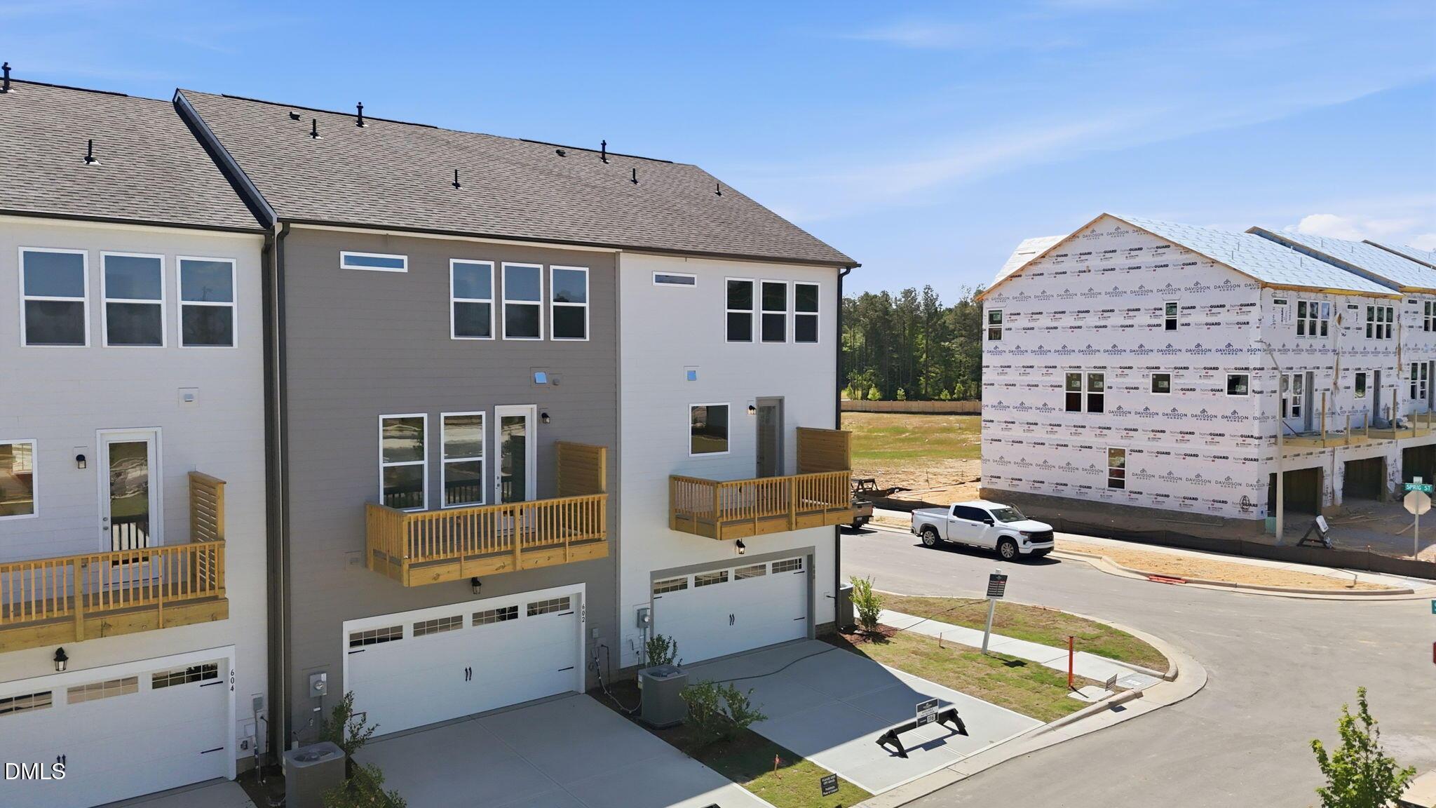 Three-story townhomes with 2-car garages at Forestville Yard Townhomes by Davidson Homes in Knightdale, North Carolina.