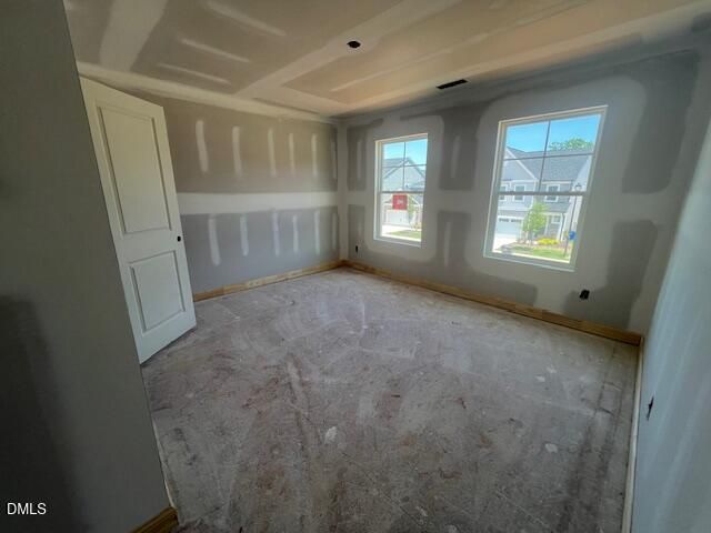 Unfinished bedroom with drywall in The Gavin C floor plan at Gregory Village, Lillington, NC by Davidson Homes.