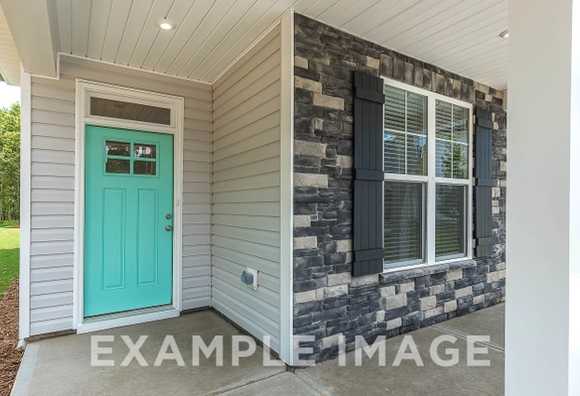 Davidson Homes The Elm Floor Plan Front Exterior with teal painted front door and porch window